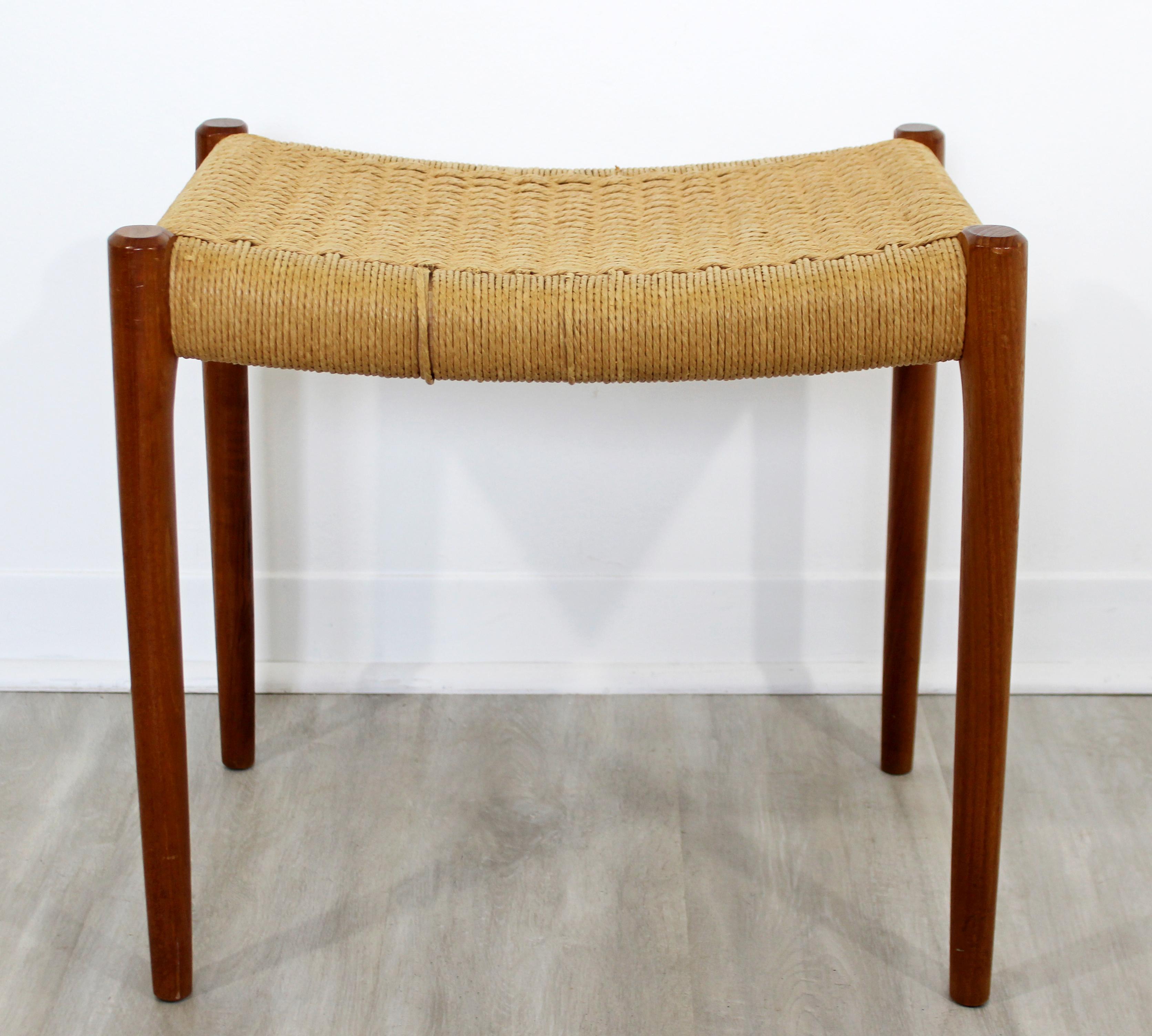 For your consideration is a Danish teak bench, with a rope seat, by Neils Moller, circa 1960s. In good vintage condition. The dimensions are 19.5