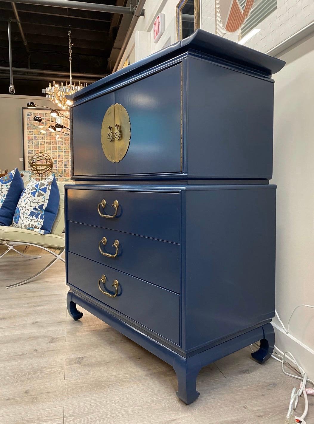Newly lacquered in a most unusual shade of blue that is impossible to miss, the Mid-Century Modern
chinoiserie style chest is guaranteed to impress. Multiple drawers for all your storage needs. Original brass hardware. Great lines and better scale.