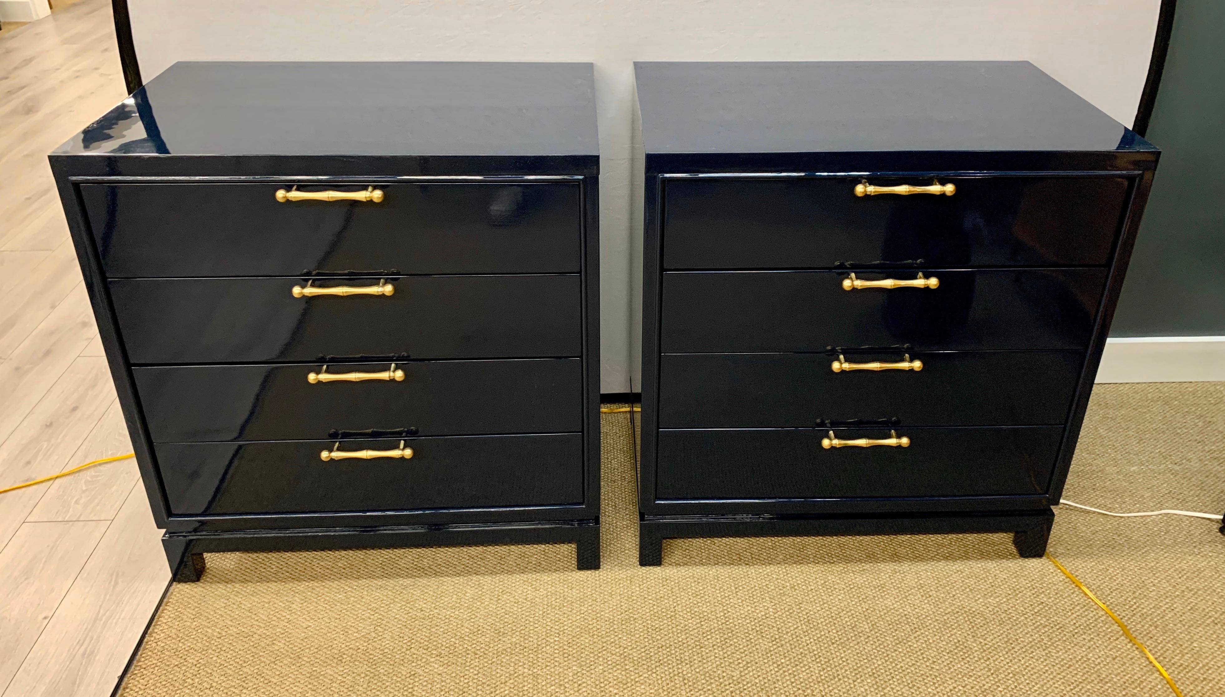 Elegant, newly lacquered navy blue chests featuring four drawers. Magnificent navy and blue lacquer offset with gold brass hardware. An iconic midcentury set in excellent condition.