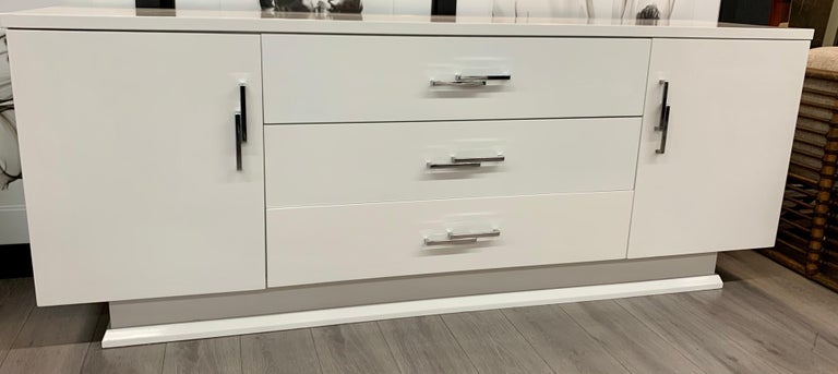Newly lacquered white server that measures just over six feet wide. See dimensions below.
Classic midcentury lines. Hardware to die for. Now, more than ever, home is where the heart is.