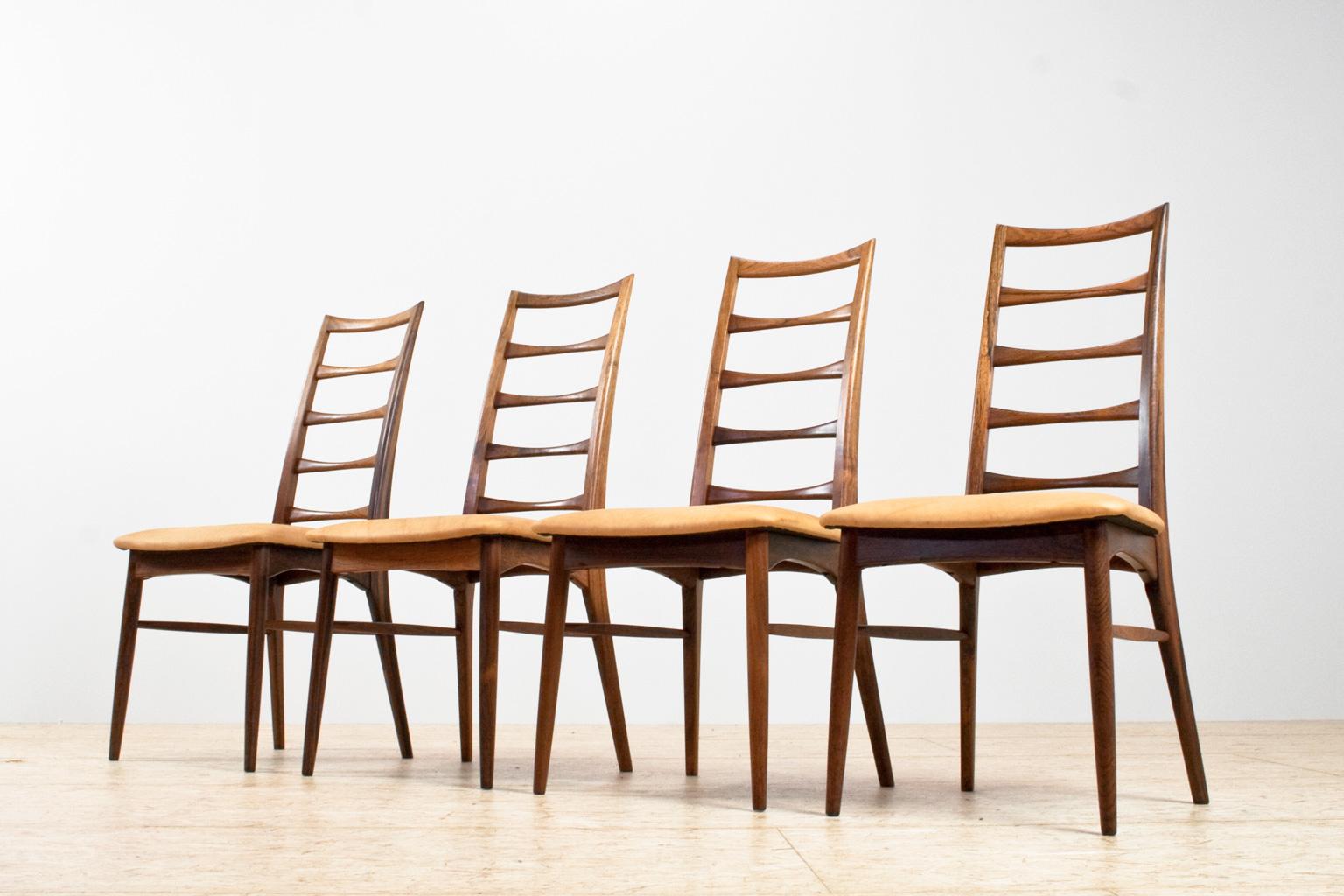 Set of 4 Niels Kofoed high spindle chairs in solid  Rosewood (Brazilian/Bolivian rosewood species), 1960s Danish modern. The set is re-upholstered in an excellent quality natural camel colored leather. Elegant and well-crafted pieces. Fine quality