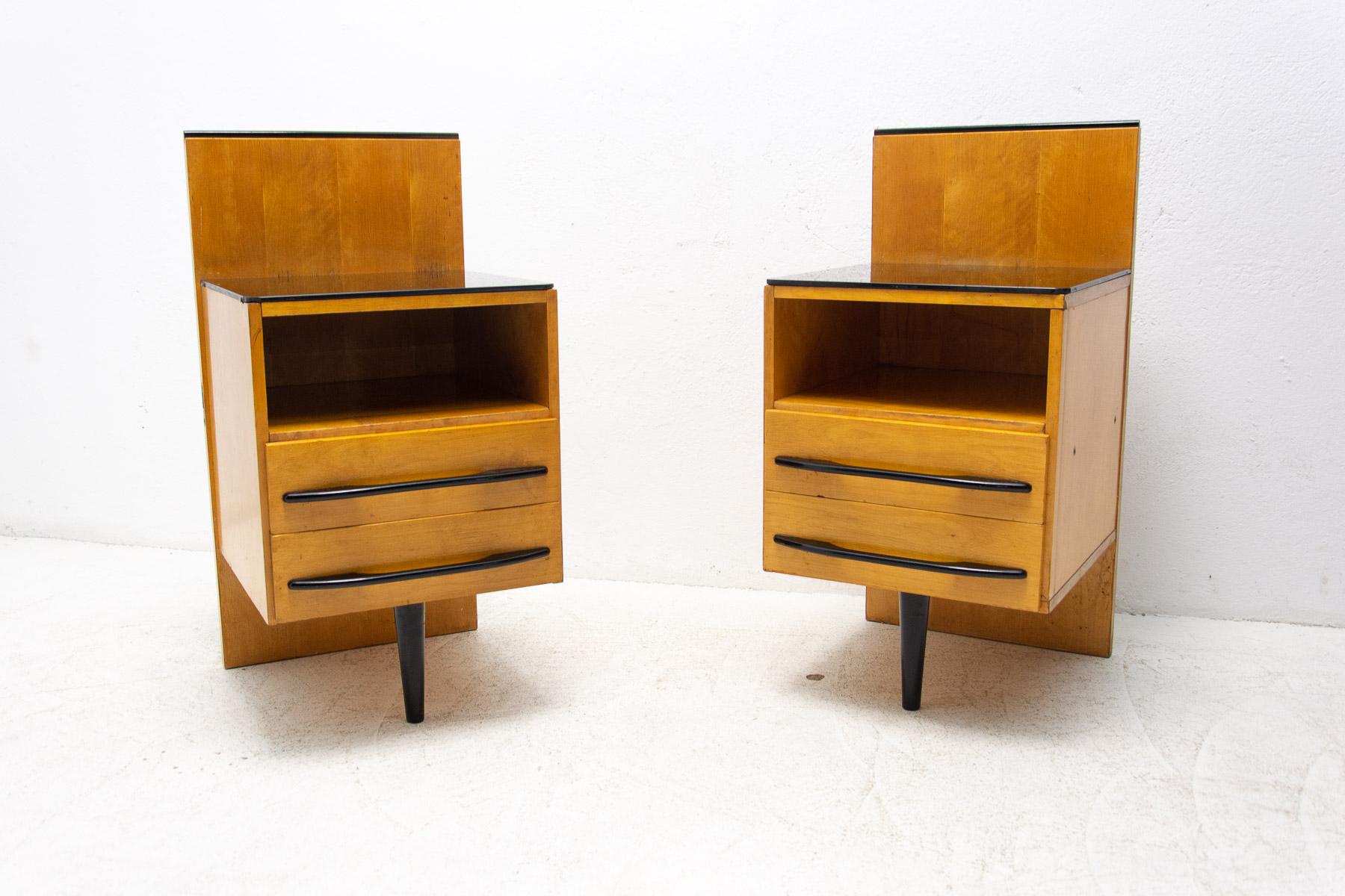 This nightstand/bedside table was designed by Mojmír Požár for UP Závody and made in the former Czechoslovakia in the 1960´s. Made of ash wood and black glass.
In good Vintage condition, showing signs of age and using.

Price is for the