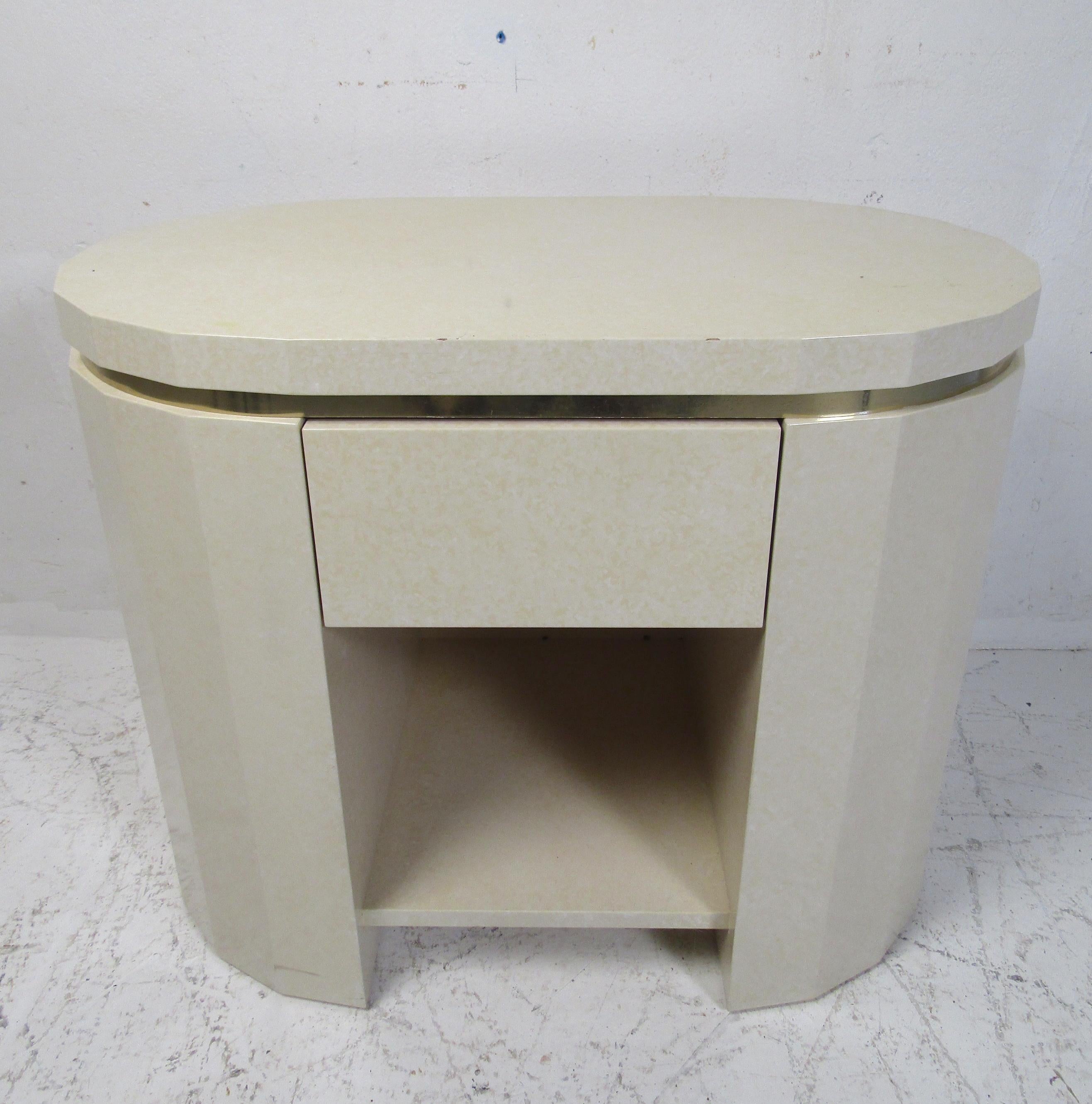 An unusual vintage modern nightstand with brass trim, a lacquered finish, and a large drawer. Perfect addition to any home, business, or office. Please confirm item location (NY or NJ).