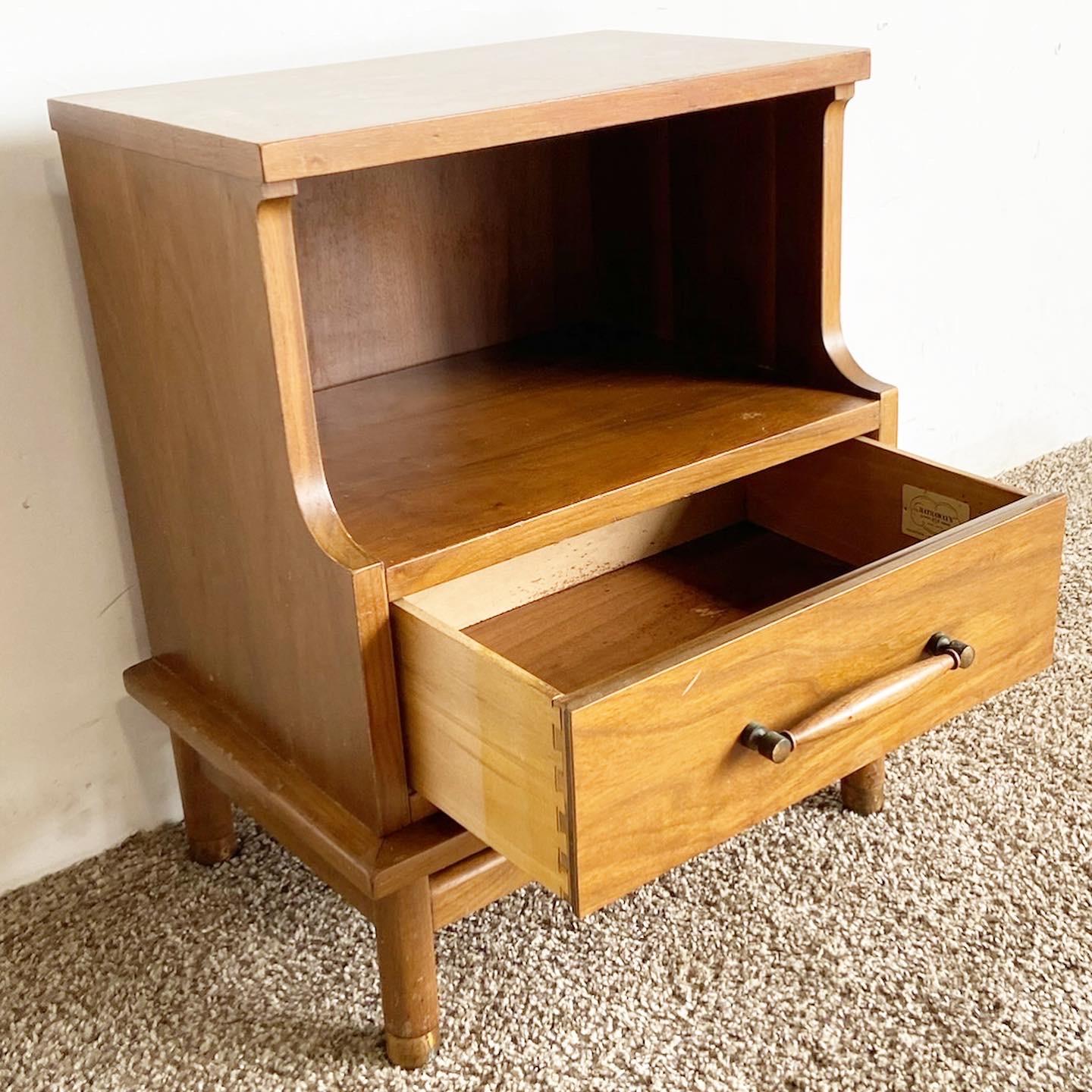 Transform your bedroom with our exceptional vintage mid century modern nightstand from Hathaway's. This nightstand boasts a spacious drawer and open shelf area, offering a perfect blend of style and functionality for your bedroom.

Exceptional