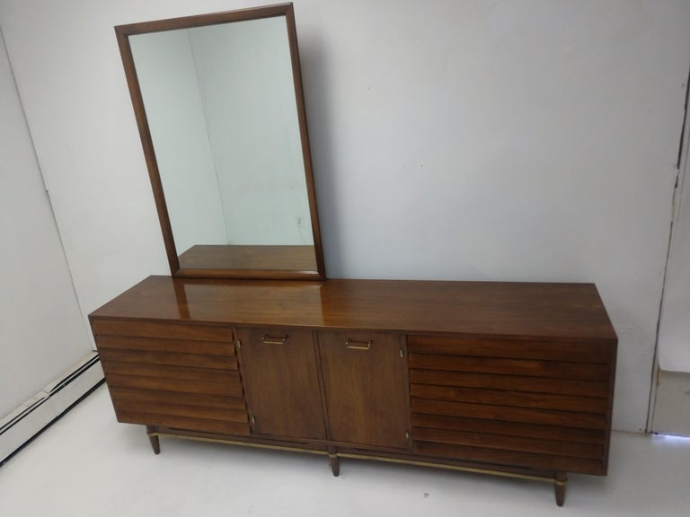 American Mid-Century Modern Nine Drawer Walnut Dresser with Mirror by Merton Gershun For Sale