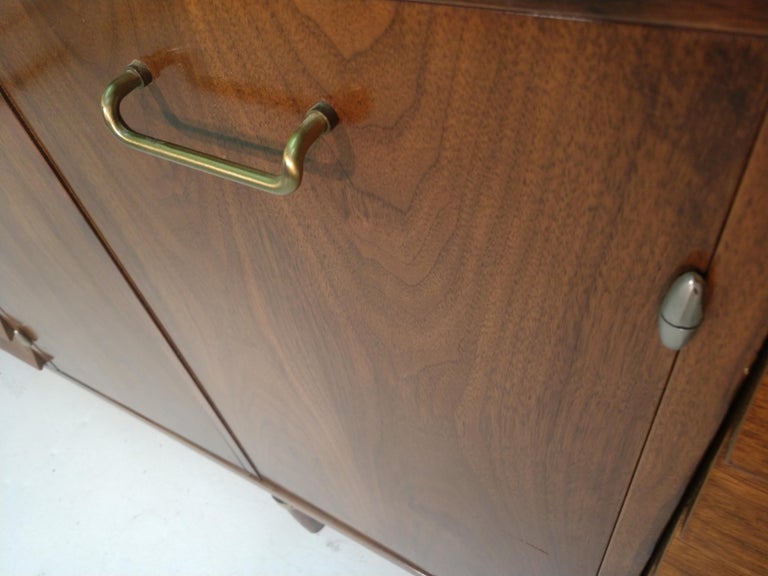 Brass Mid-Century Modern Nine Drawer Walnut Dresser with Mirror by Merton Gershun For Sale