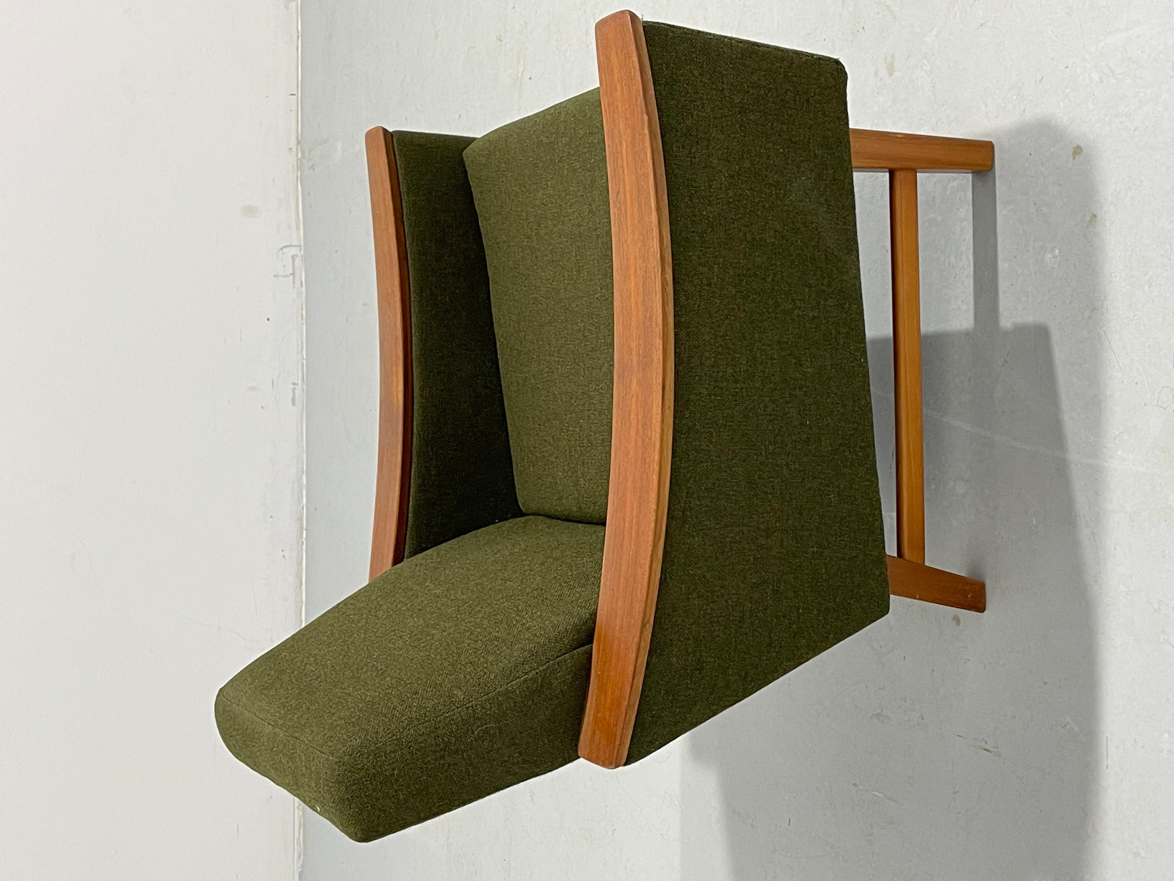 Nearly perfect Norwegian teak mid-century modern armchair. Circa the 1960’s, truly eye-catching. 

Made in Norway, designed by Oscar Langlo . Deep military green wool upholstery. Foam is wonderfully comfortable. Gorgeous teak armrests. 

A