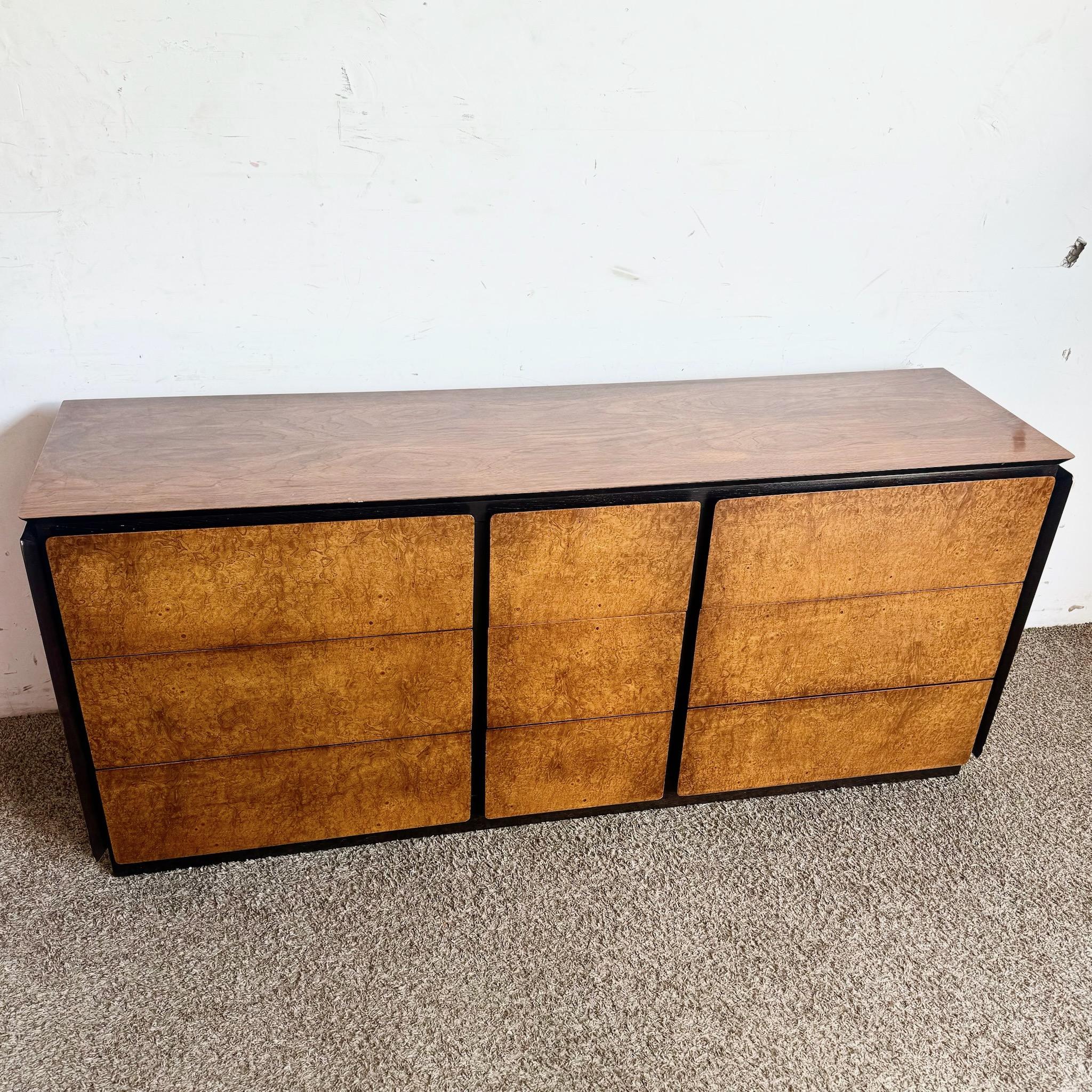 Enhance your bedroom with the rich textures and sleek design of this Mid-Century Modern Oak and Burl Wood Dresser by Lane Furniture. This stunning piece features a harmonious blend of oak and burl wood, showcasing the natural beauty of the grain.