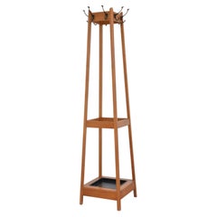 Perchero de roble de estilo «Mid-Century Modern» con soportes para paraguas integrados y bandeja recogegotas