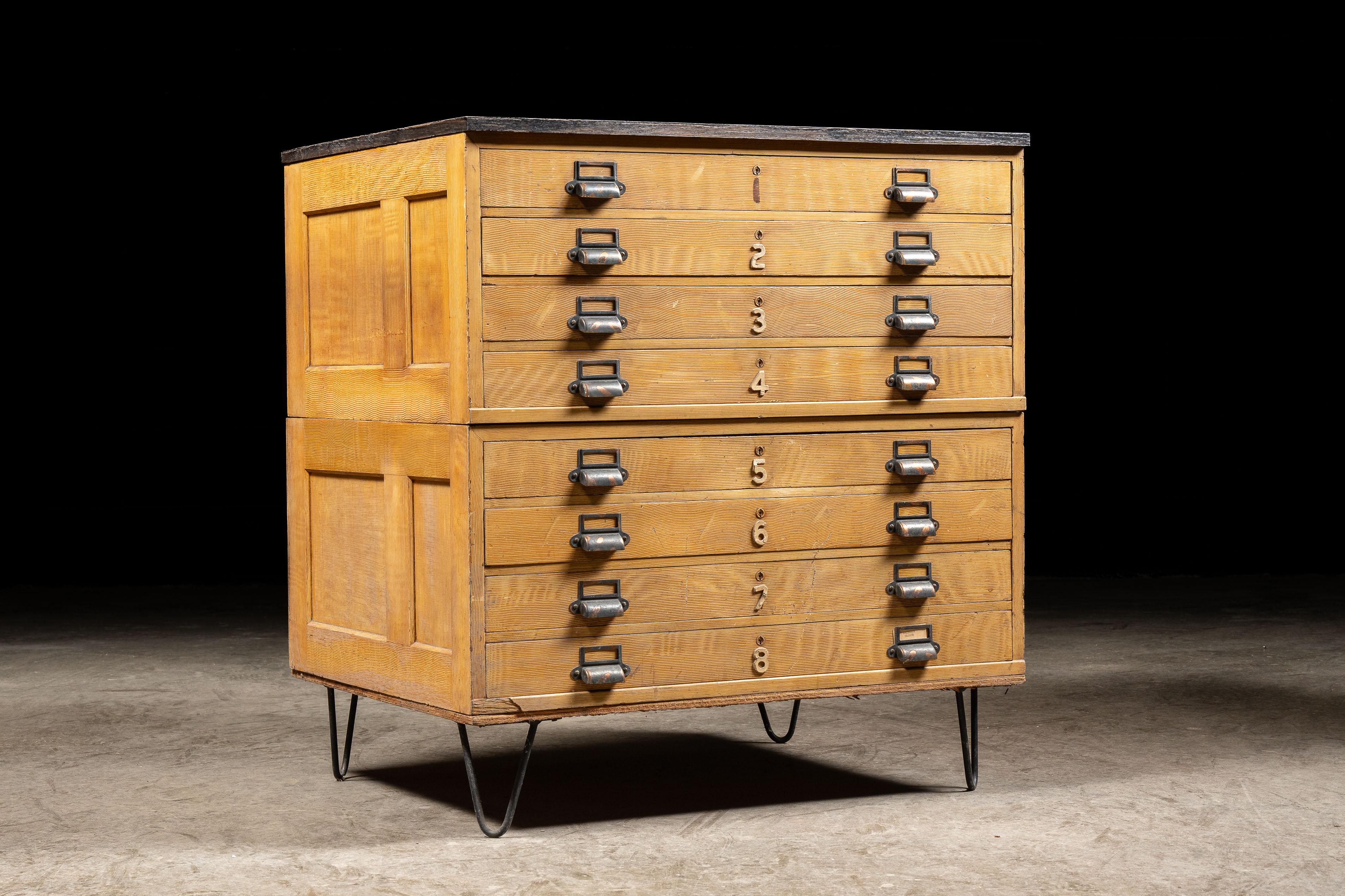 Vintage wooden flat file cabinet.

This piece features a unique numbering system, opting to use large carved numbers in place of more traditional methods. The result is a striking piece that also boasts the clean lines and simple design often found