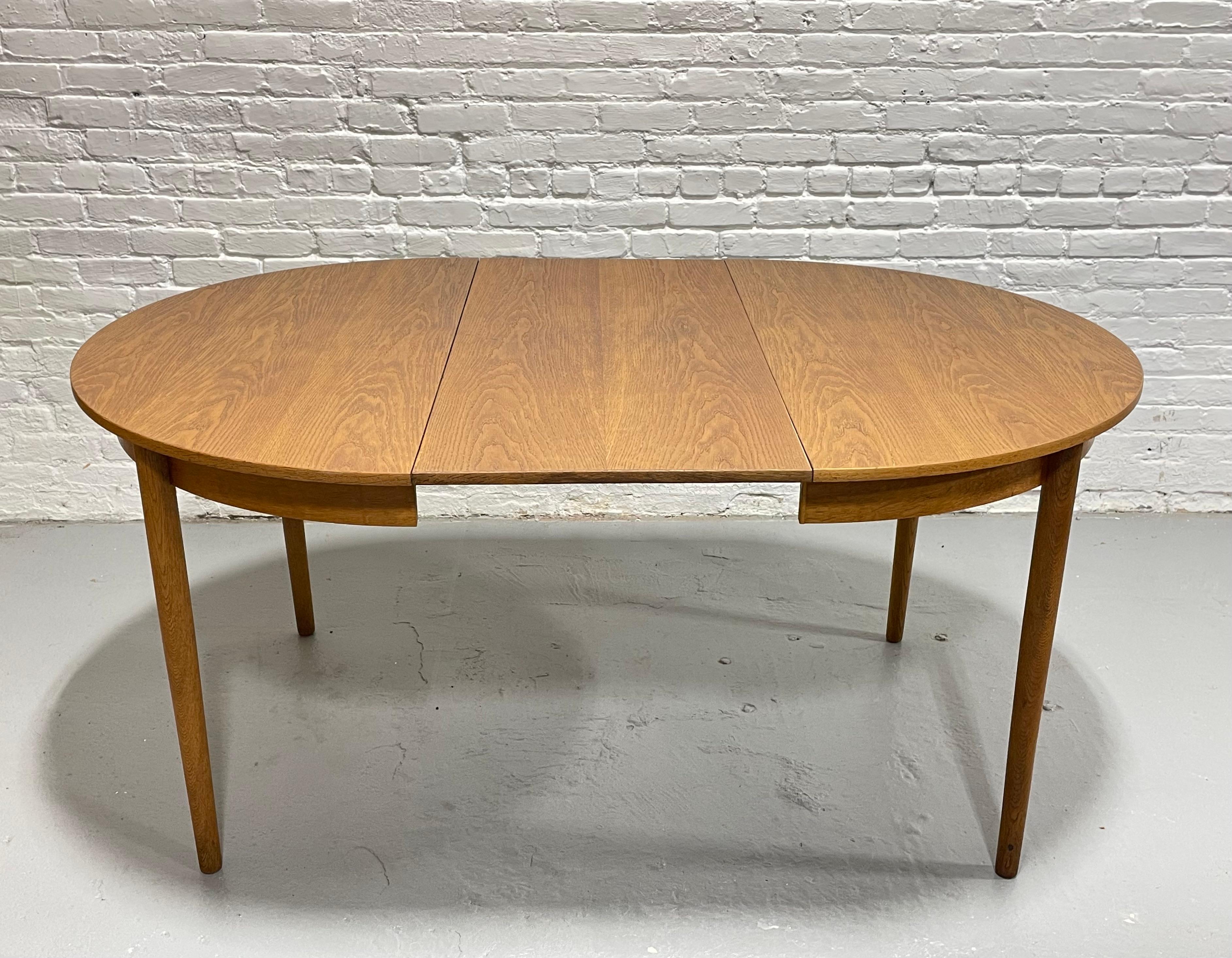Mid Century MODERN Oak ROUND to OVAL Dining Table, Made in Denmark, c. 1960's In Good Condition In Weehawken, NJ