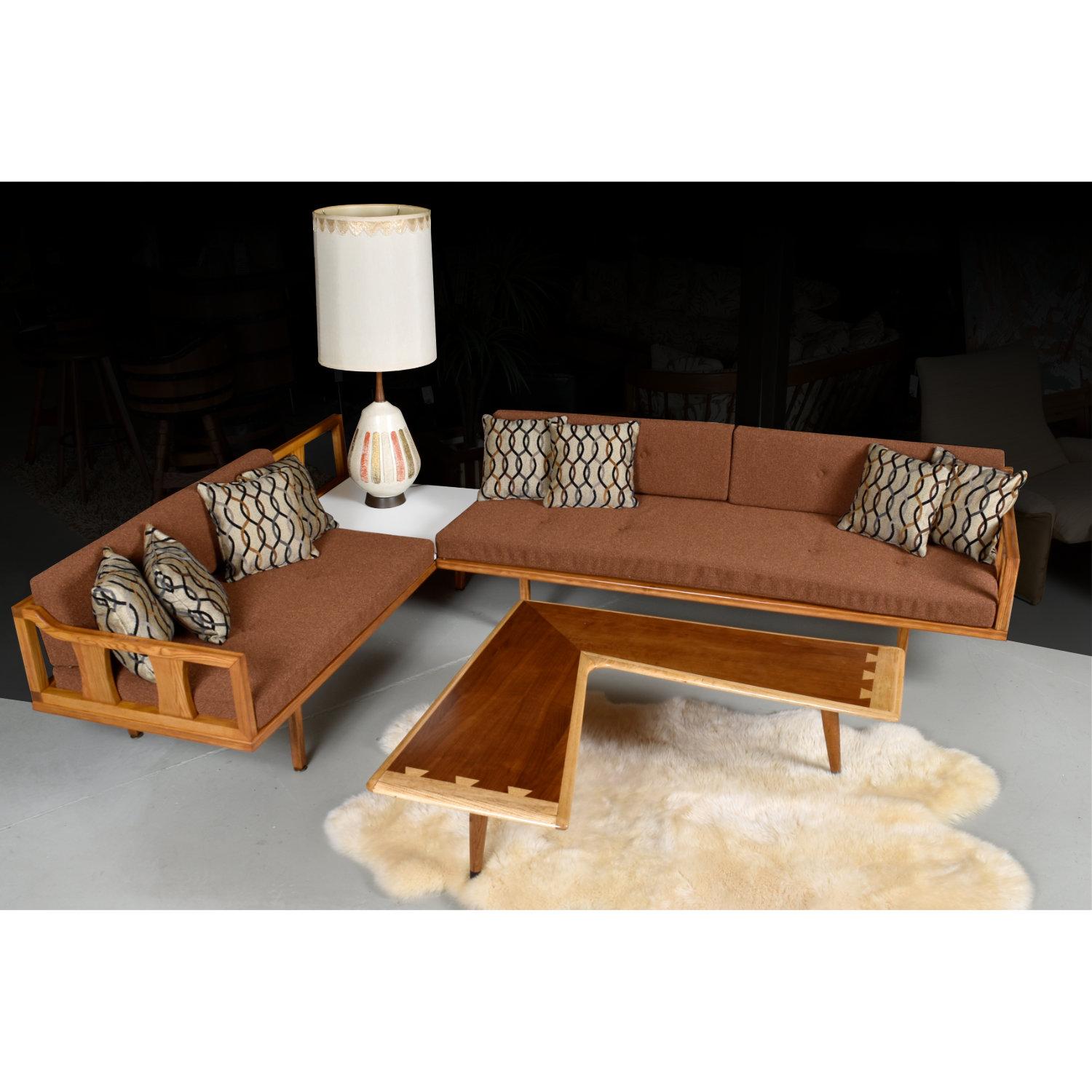 Beautifully restored vintage 1950s Mid-Century Modern sectional with reversible corner table. This iconic sectional has been fully restored. It’s as if you’re buying a “new” vintage sofa. The entire solid oak wood frame has been completely