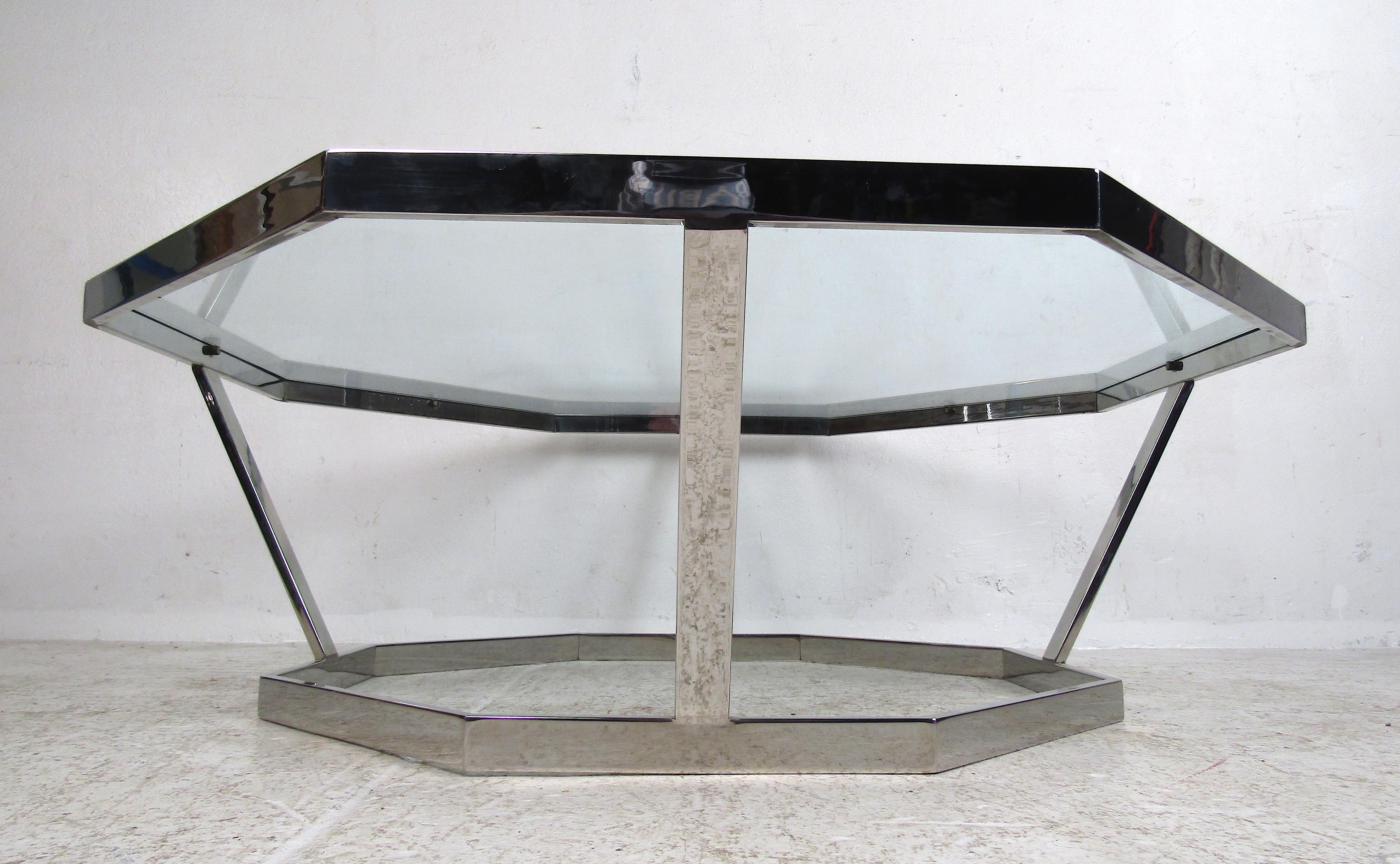 Unusual Mid-Century Modern octagonal coffee table with a chrome frame and glass tabletop. Interesting piece that is sure to compliment any modern interior. Please confirm item location with dealer (NJ or NY).