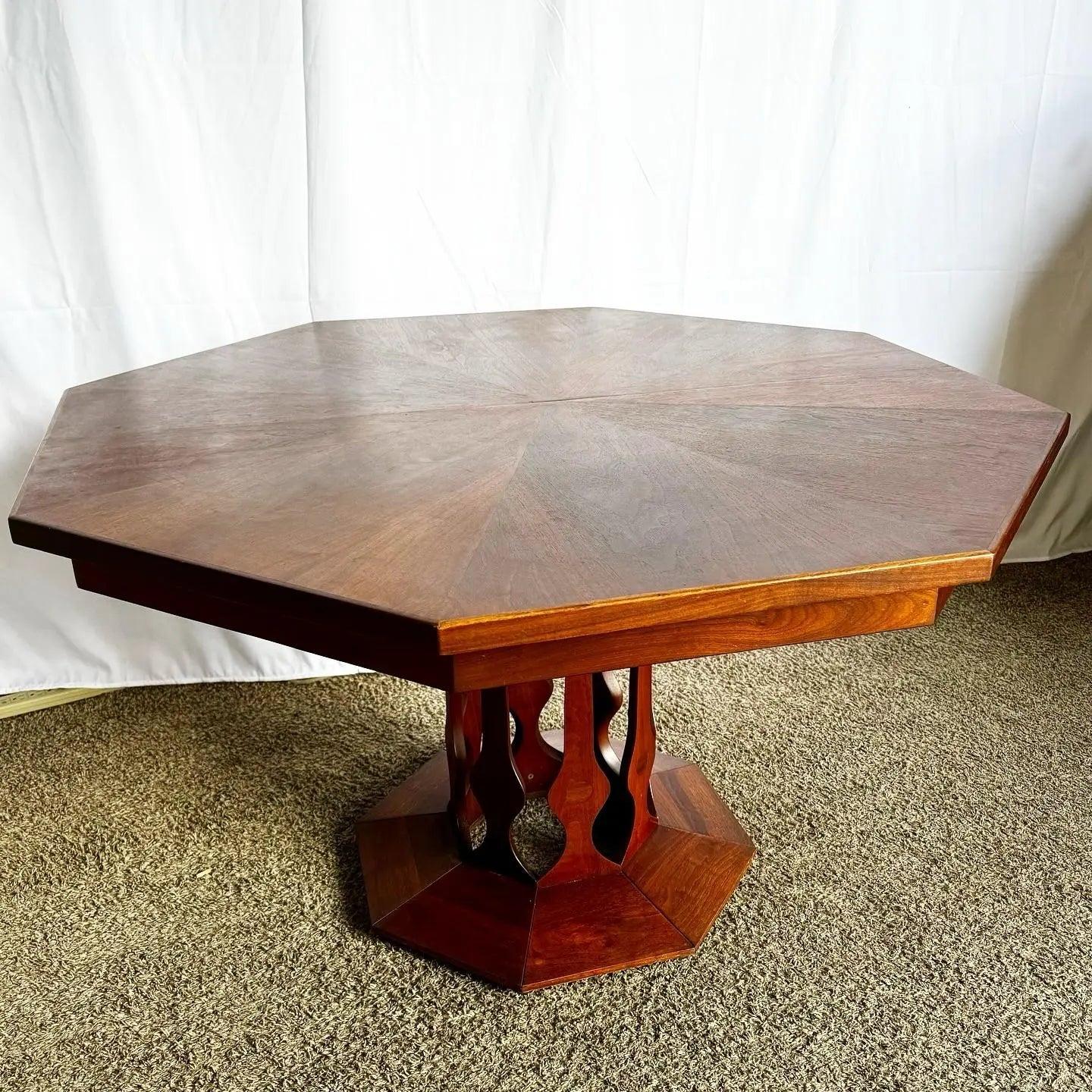 Mid-Century Modern Octagonal Dining Table by Walter of Wabash, featuring a pedestal base and three extension leaves for versatile dining.
 
 Some wear to the finish as shown in the photos and the leaves are a lighter color from being locked away