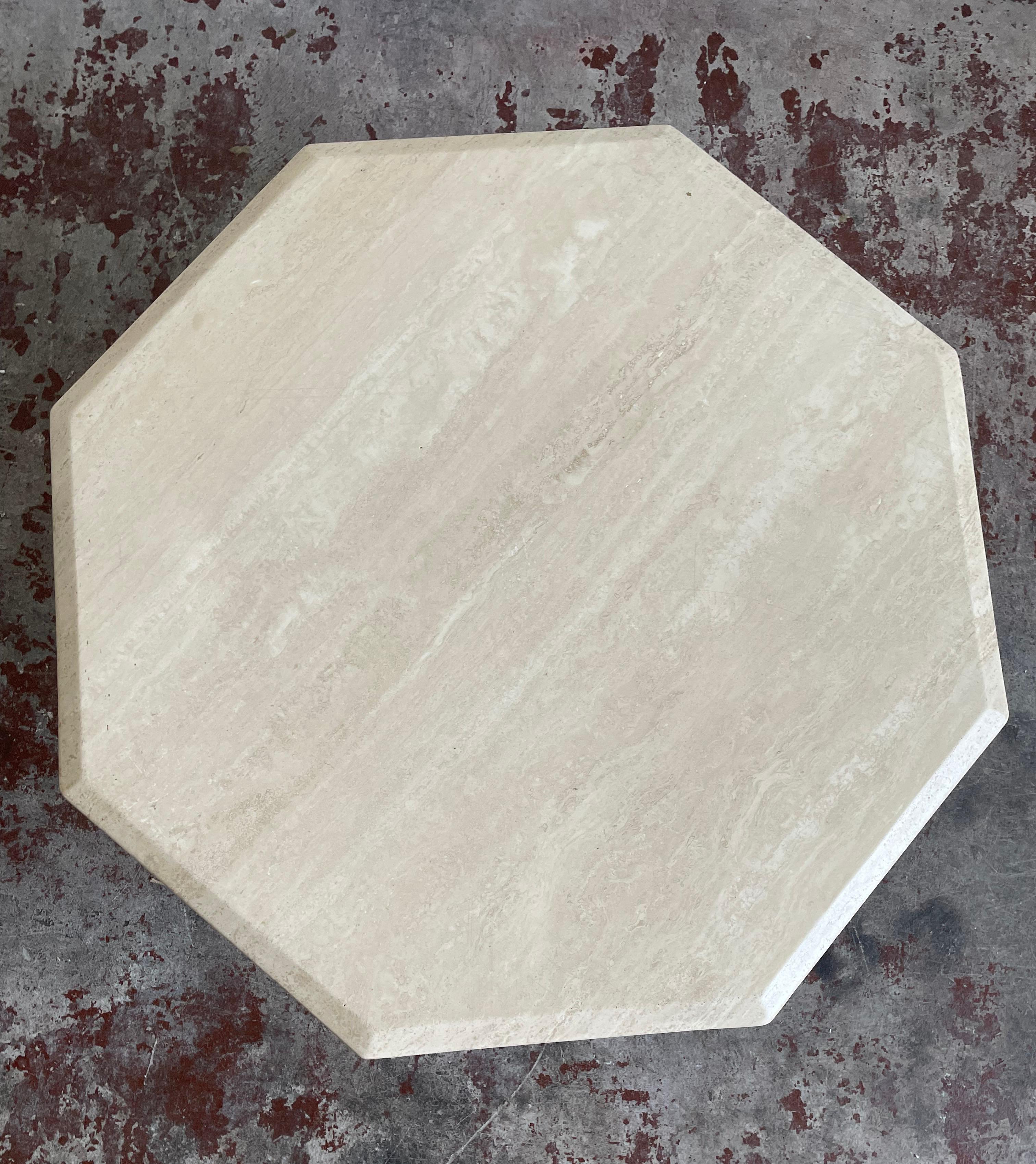 Minimalist Italian coffee table made of travertine stone, manufactured in the 1970s

The table consists of freestanding octagonal-shaped table top and triangle-shaped base

The table remains in very good vintage condition, without visible