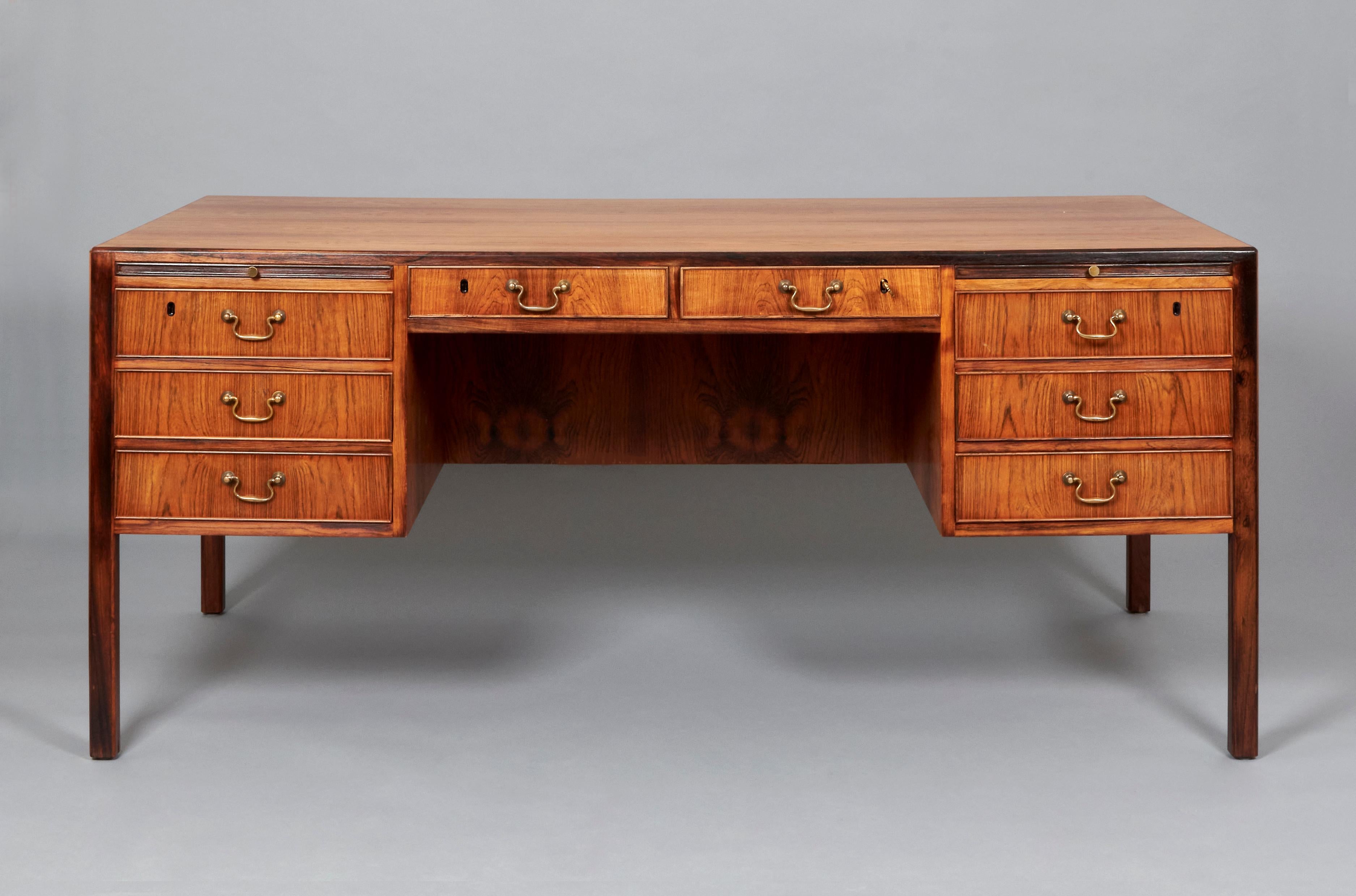 Large executive desk designed by Ole Wanscher for AJ Iversen. Denmark, 1960s. 
This Desk features a solid structure and and interesting set of drawers and storage space, including two small display shelves at the front. 
Ole Wanscher was a key