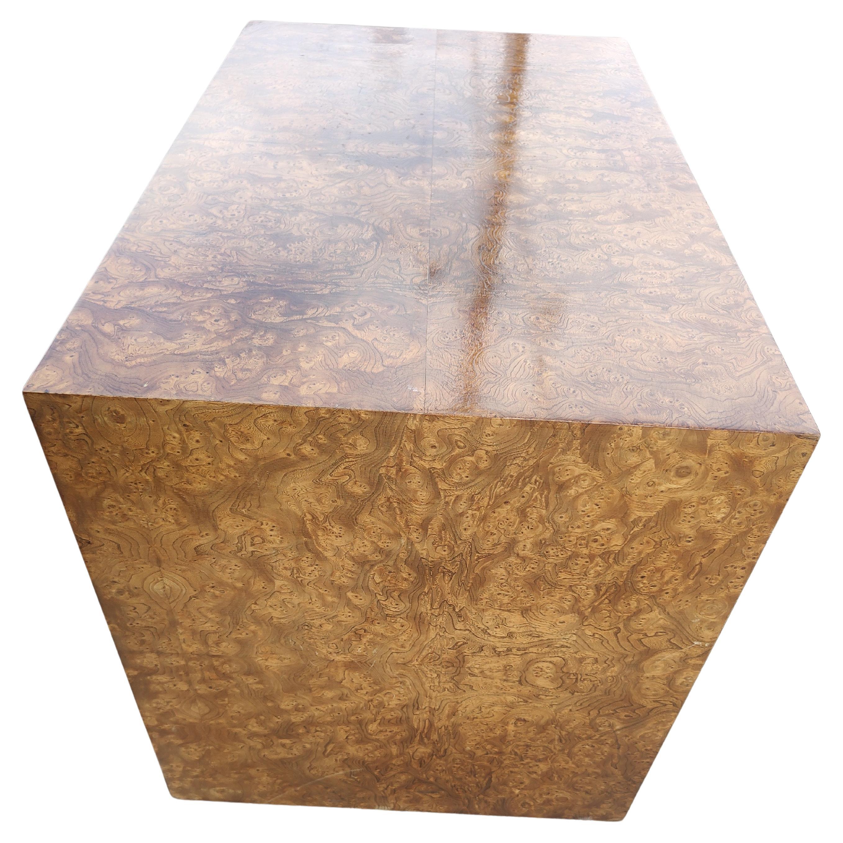 Spectacular burled olivewood rectangular end table with an architectural feature. An opening in the piece which completely passed from from side to side measuring 23 x 20 x 7H. Table itself is 33 x 20 x 22.75H. Perfect for a TV stand with room for