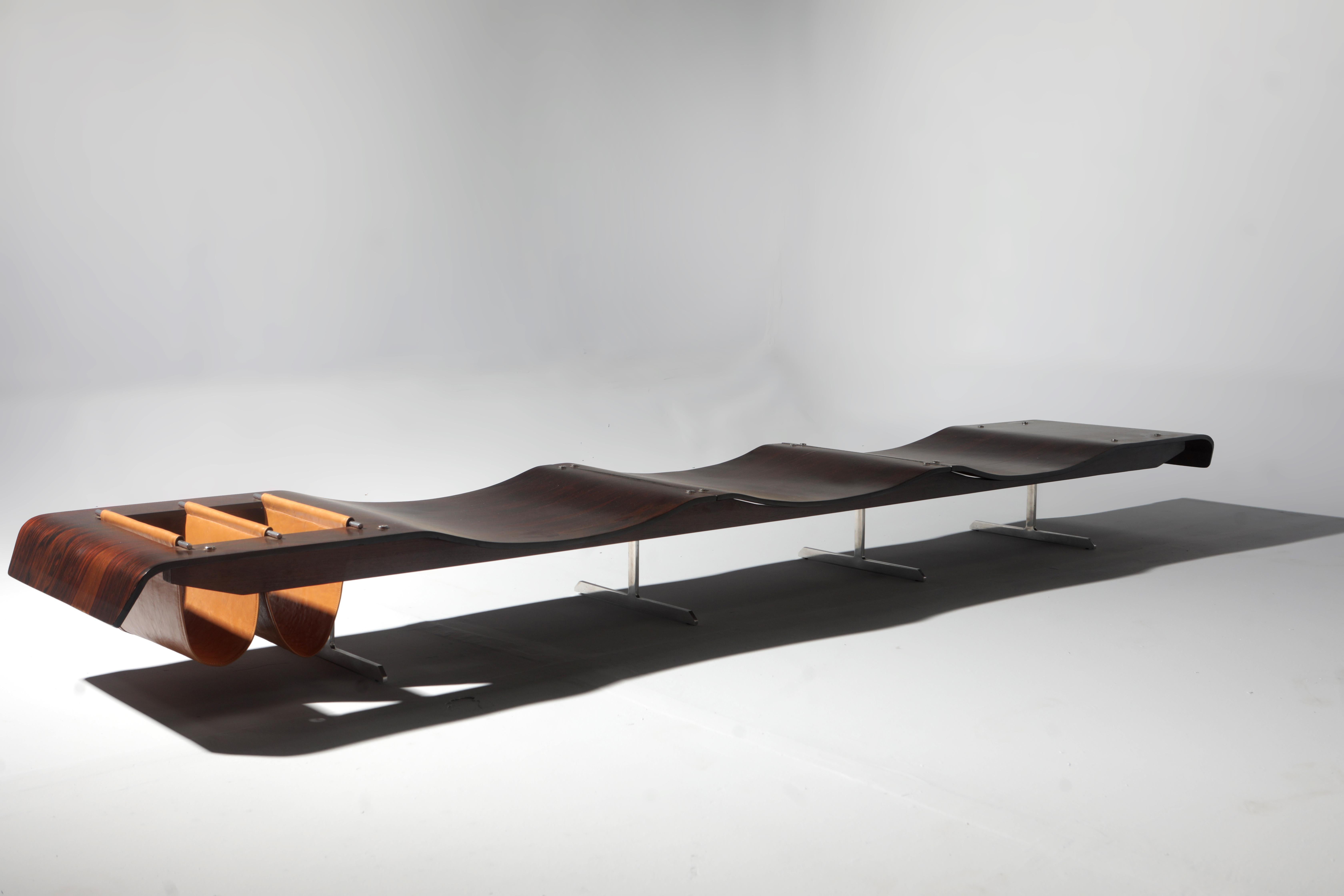 Mid-Century Modern Onda (Wave) bench with magazine holder by Jorge Zalszupin, Brazil, circa 1960s.

Designed by Zalszupin circa 1960s, the Onda bench showcases some of the main characteristics of the designer's work: great technical care in the use