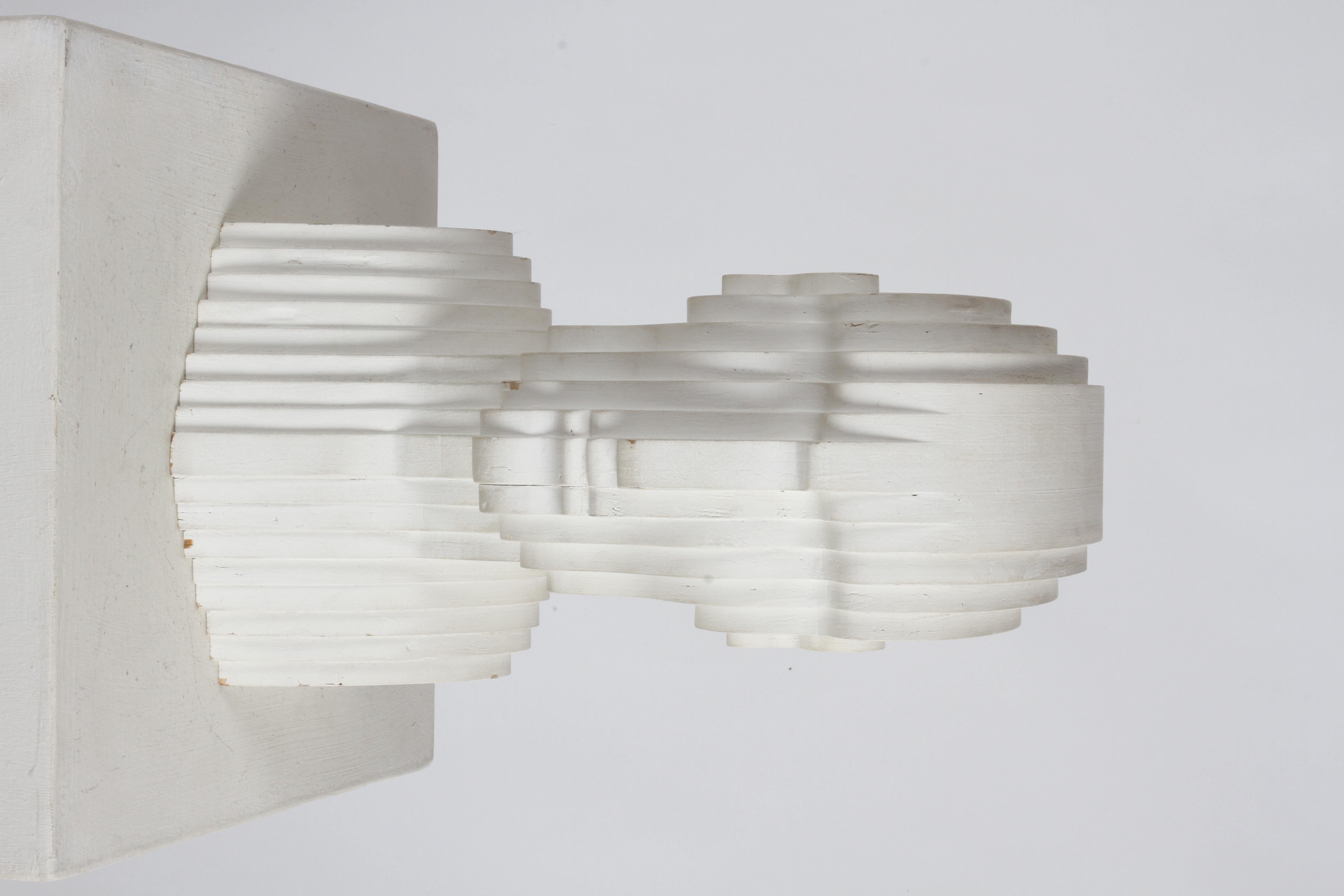 Unknown artisan handmade folk art Mid-Century Modern 1970s Op-Art style wood bust made of 17 layered concentric biomorphic off white painted plywood panels. Plywood varies from 1/2