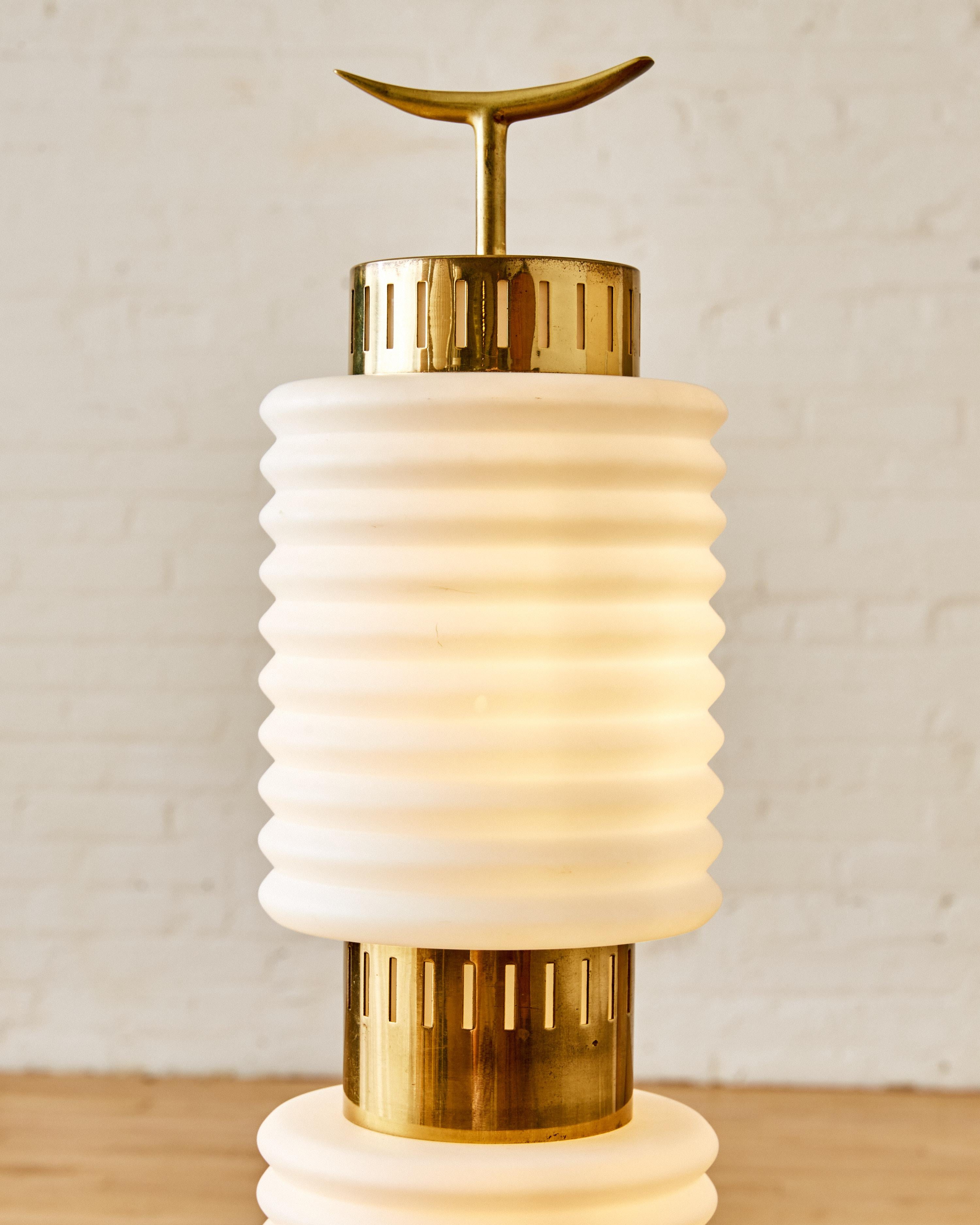 Mid-Century Modern opaline floor lamp, circa 1960s, with brass hardware and a rosewood base.

