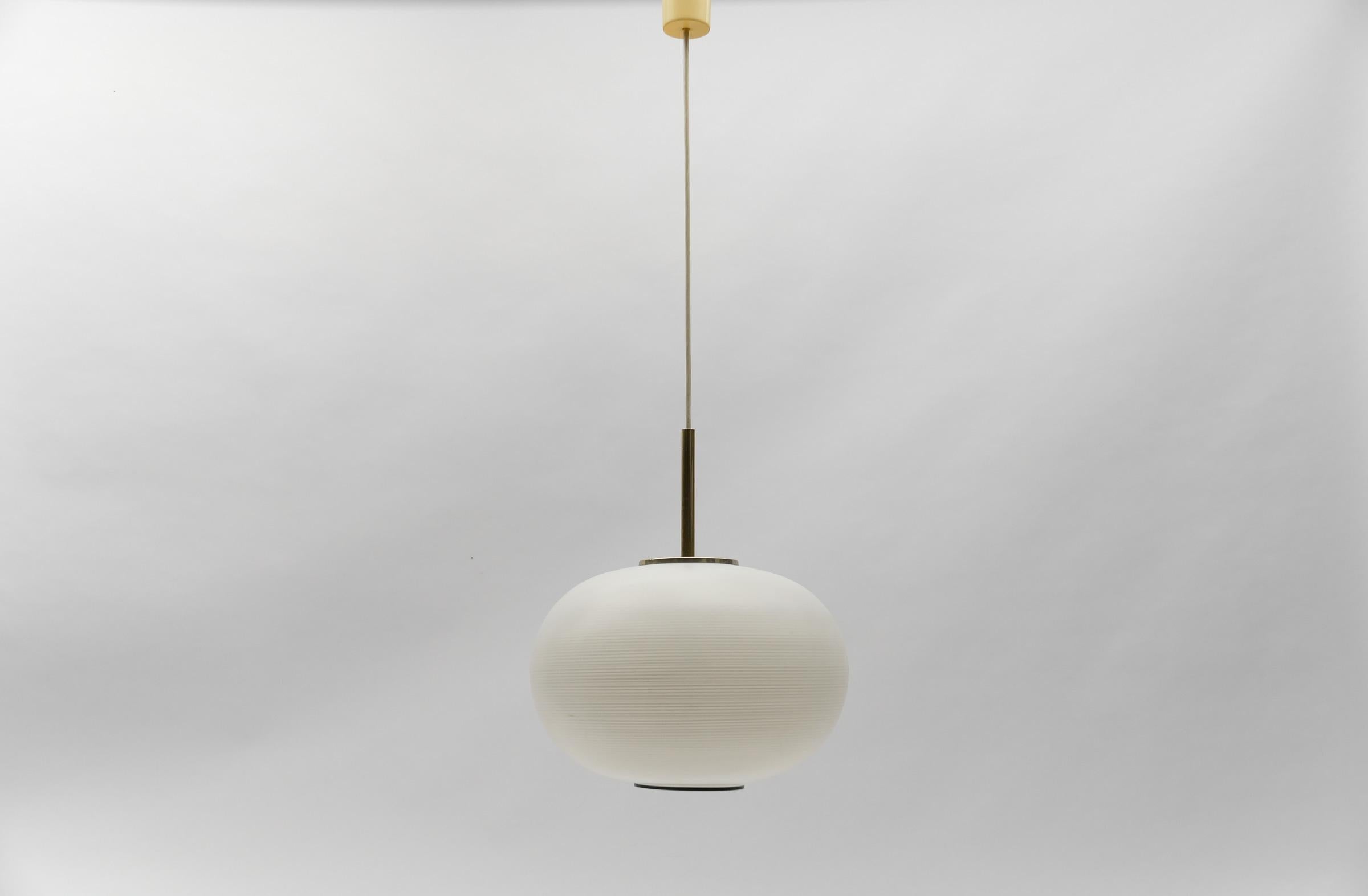 Mid Century Modern Opaline Glass Ball Pendant Lamp by Doria, 1960s Germany

Dimensions
Diameter: 14.96 in. (38 cm)
Height adjustable: 23.62 - 39.37 in. (60 - 100 cm)

One E27 socket. Works with 220V and 110V.

Our lamps are checked, cleaned and are