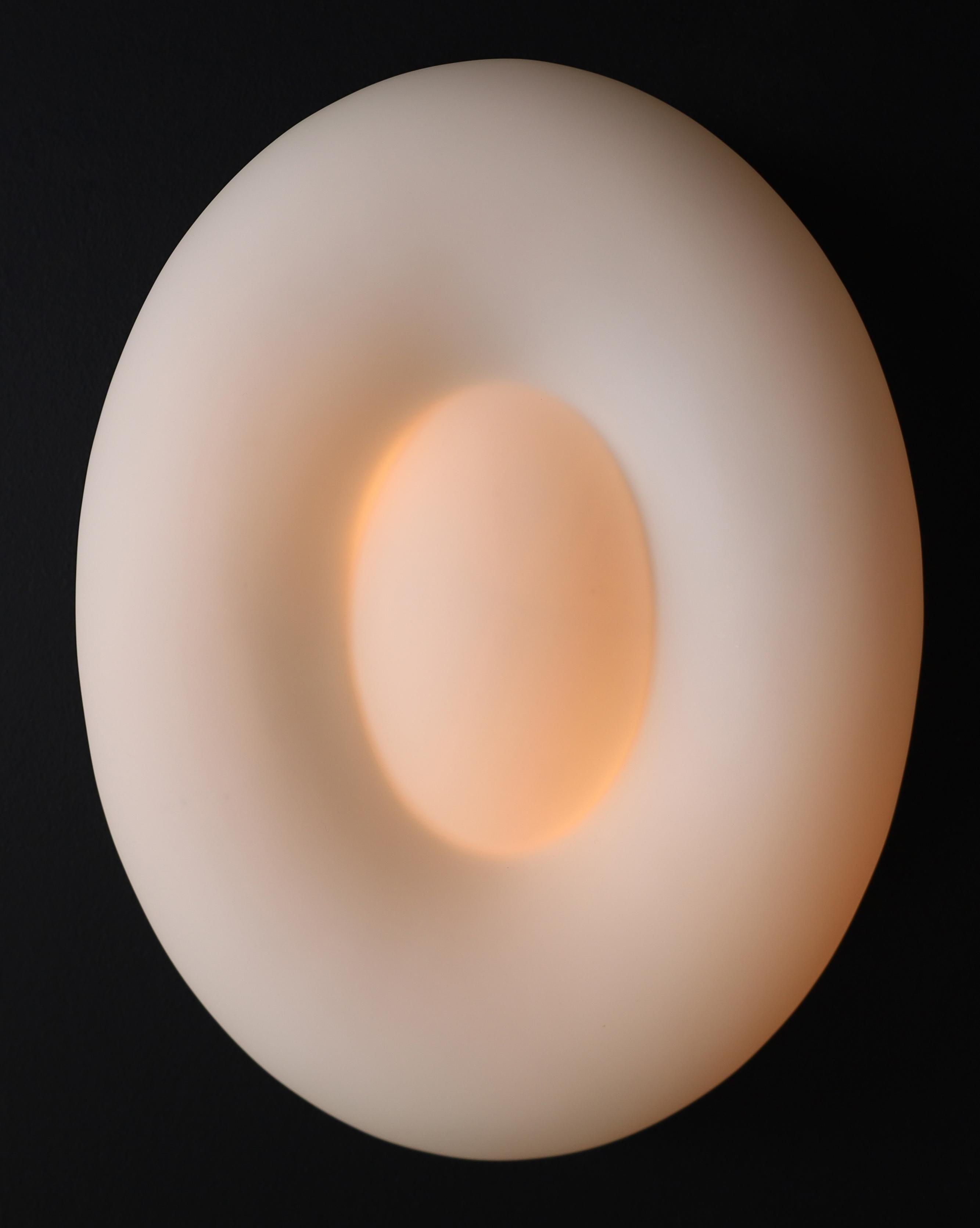Mid-Century Modern Opaline Glass Wall or Ceiling Lights, Italy, 1970s (14 Available, Priced per Fixture)

Description:

Offered here is a set of Mid-Century Modern lights made in Italy during the 1970s. Each fixture features a sculptural disc form