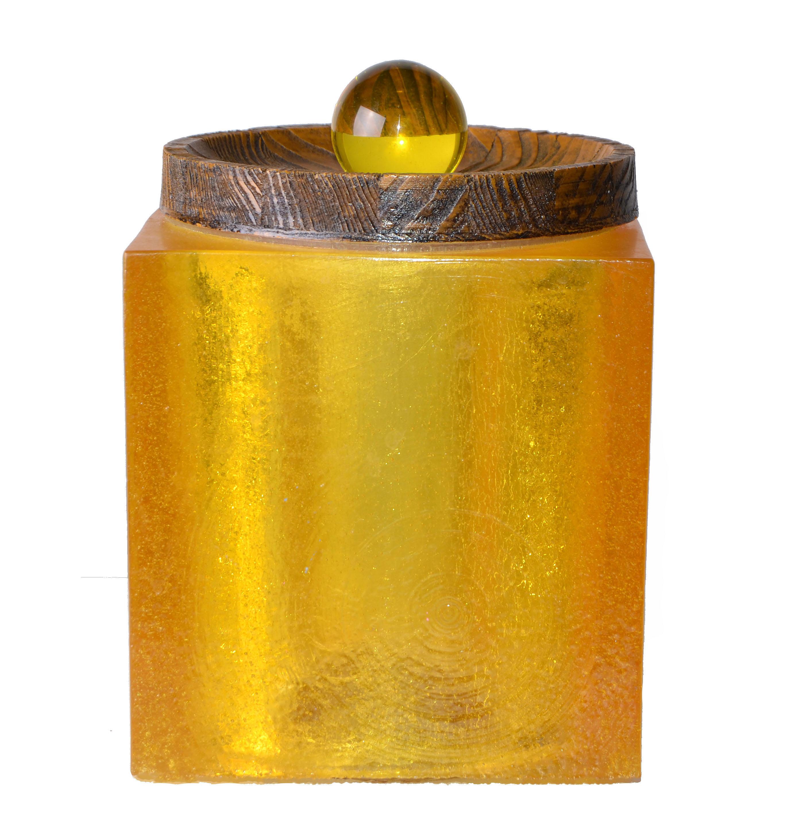 1960s solid amber color acrylic ice bucket with cork bottom and wood and cork lid.
Keeps the ice cubes frozen for a long time as the lid sits tight on the bucket.
 