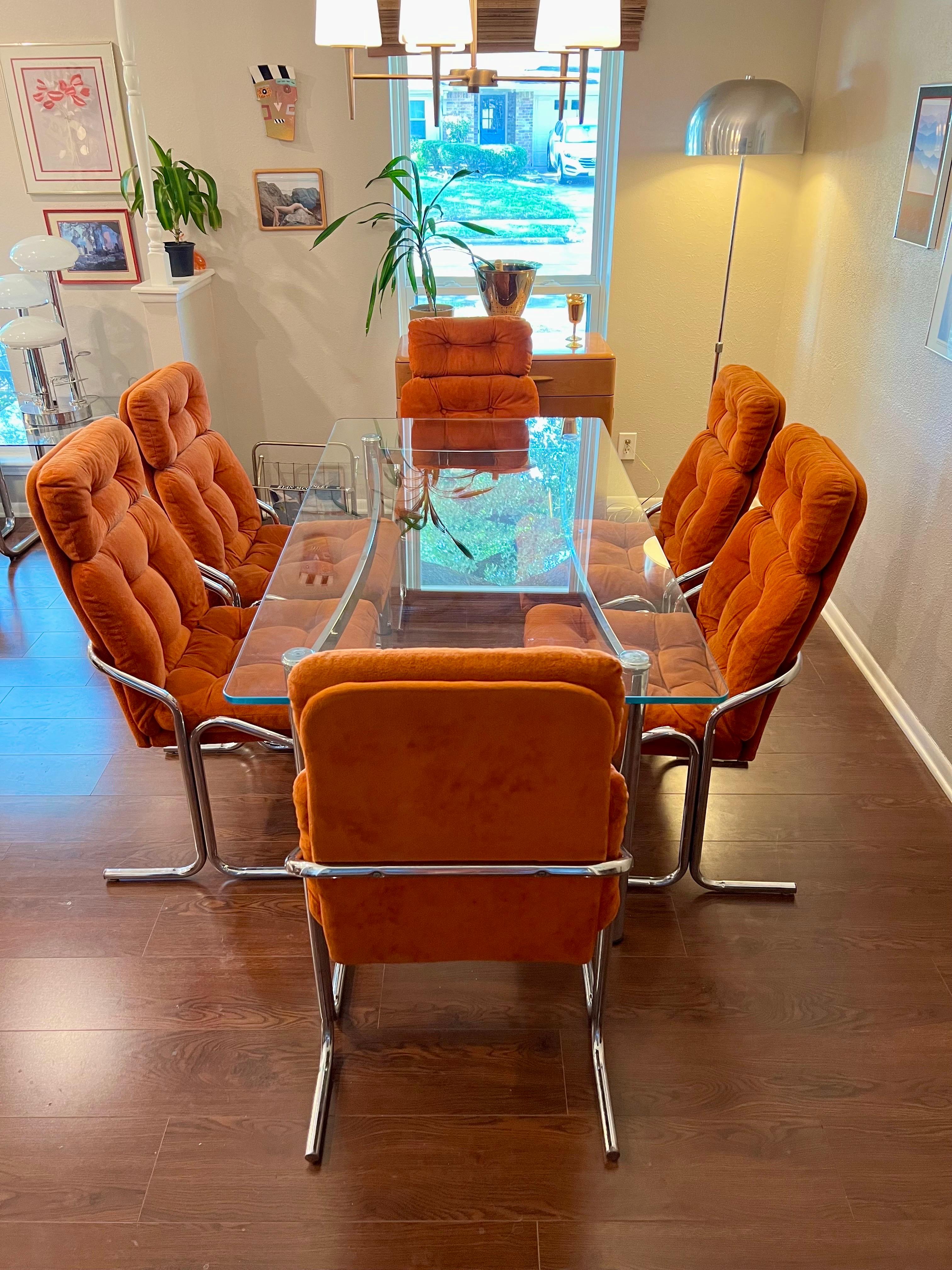 Stunning cutting edge Mid-Century Modern dining set. In the manner of jerry Johnson. Includes a set of 6 chrome dining chairs with a matching dining table by Cal-Style Furniture Manufacturing, circa 1979. All original, in great vintage condition.