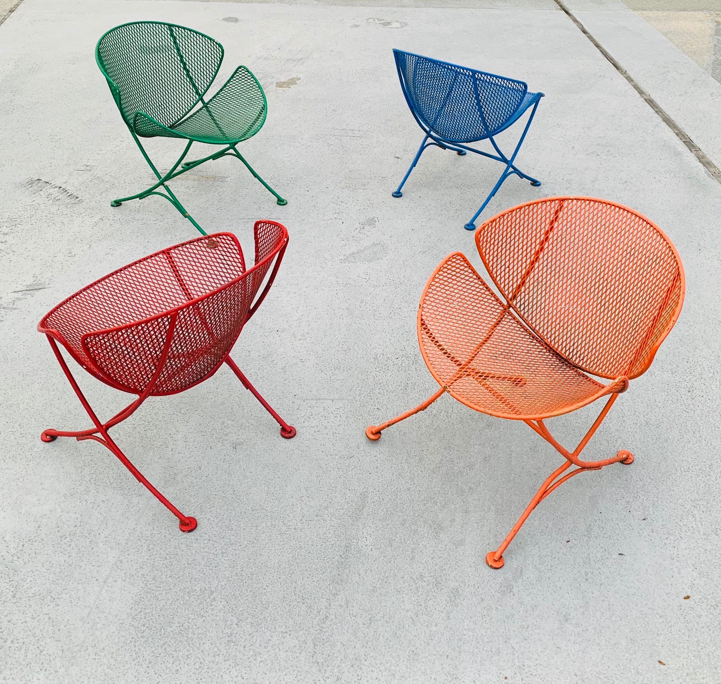 Vintage Maurizio Tempestini for John Salterini orange-slice chairs in iron. 

These chairs are just the most fun. Currently painted in an array of colorful hues. 

We can gladly have these sandblasted & powder coated to your specifications if