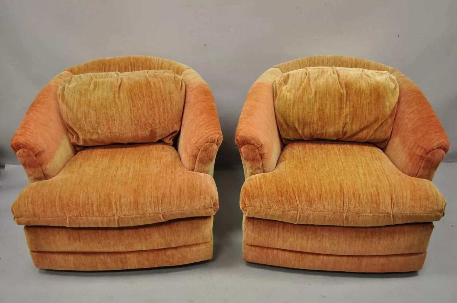 Vintage Mid Century Modern Orange Upholstered Swivel Club  Lounge Chairs by Flexsteel - a Pair. Item features a swivel base, fully upholstered frames, original label, and quality American craftsmanship. Circa Late 20th Century. Measurements: 27.5