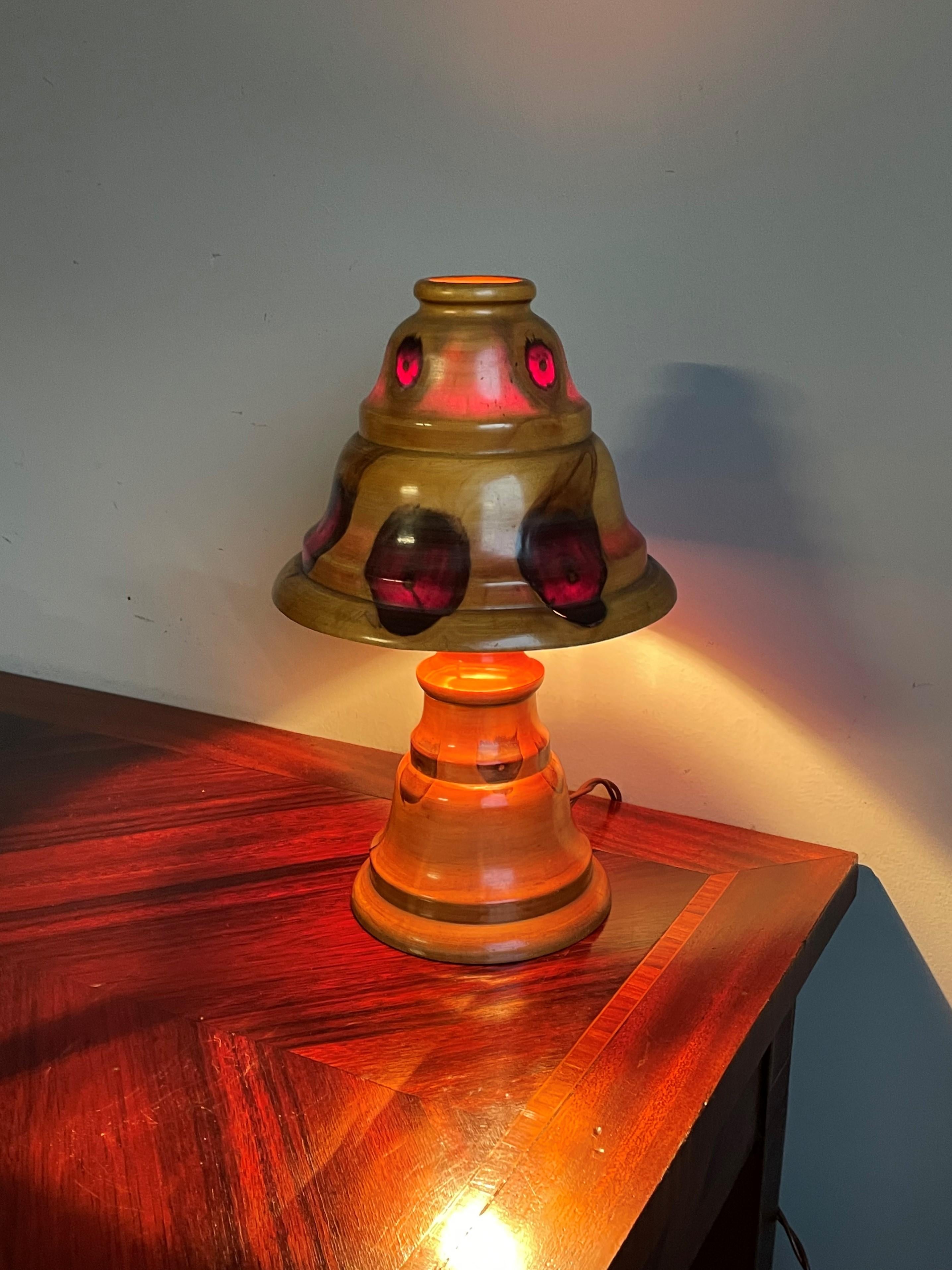 Rare and beautiful shape, wooden table lamp with all natural colors.

This midcentury era, mushroom shape table lamp has some of the most beautiful, natural colors you will ever see. We don't know what type of wood this lamp is made of, but this