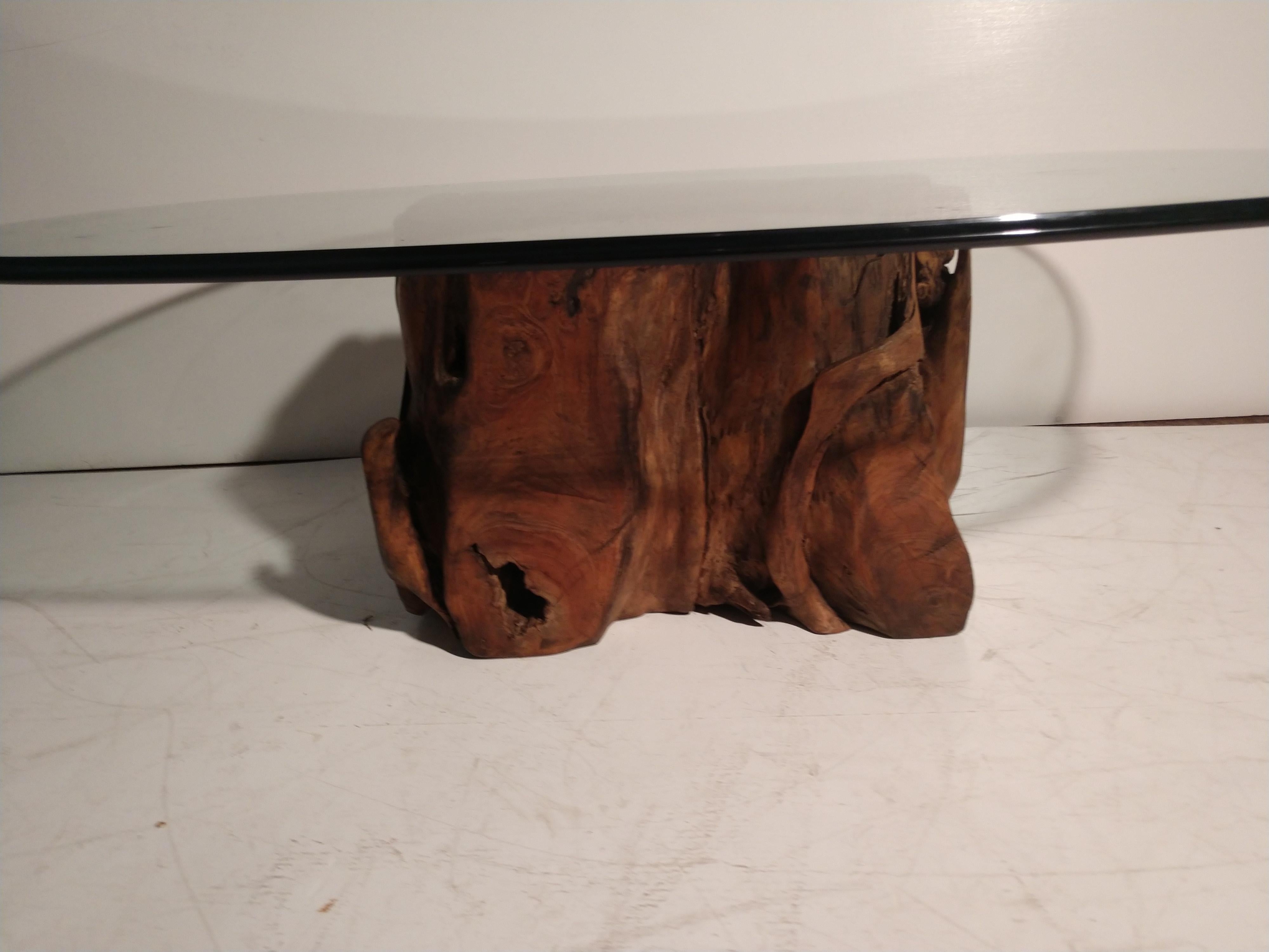 glass table with tree root base