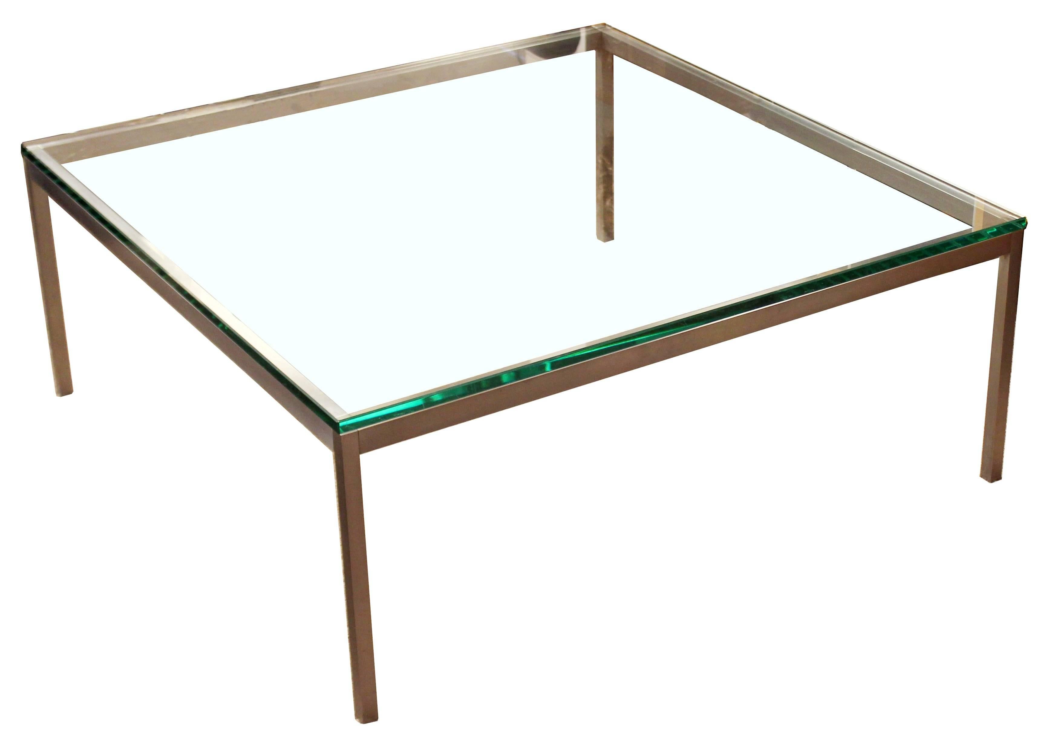 For your consideration is a gorgeous, square coffee table, with a metal base and thick glass top, by Knoll International, circa 1970s. Original tags and glass. In very good condition. The dimensions are 42