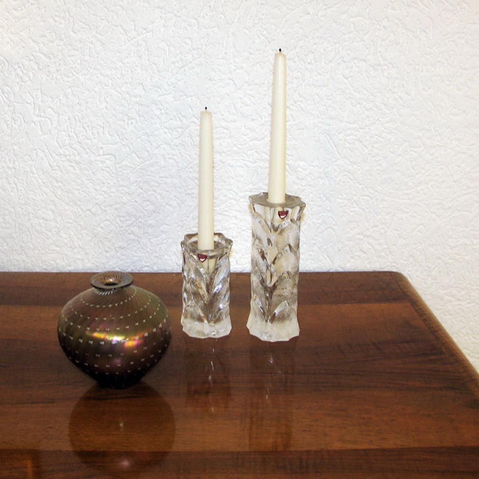 Vintage Orrefors crystal candleholders, nice relief surface vegetal motif, Sweden, 1970s. Heavy cast crystal, makers label to the front. Exceptional condition, some traces of stearin.

Dimensions:
The large one - height 19.5 cm, diameter 7
