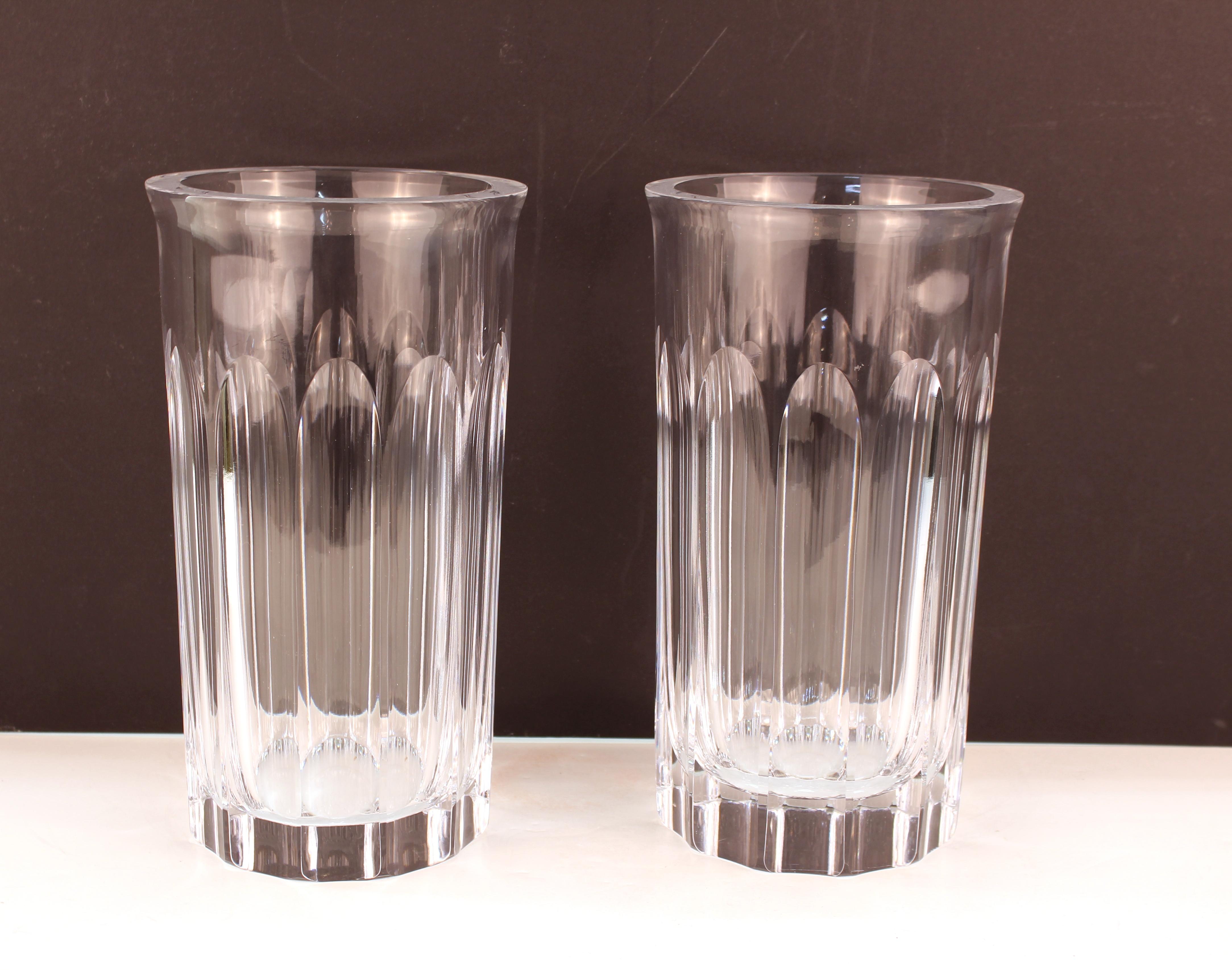 Pair of Mid-Century Modern heavy glass vases made by Orrefors. The pair is marked on the bottom and has numbers. In good vintage condition.