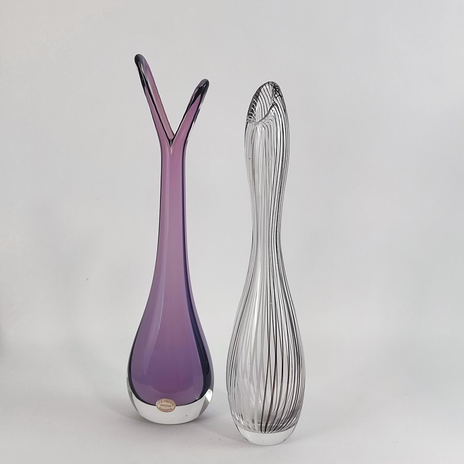 Beautiful purple glass vase made by Orrefors Sweden, realized in Sommerso technique, original manufacturer label to the front, signed and numbered to the bottom. Excellent condition.
Dimensions: 9 x 6.5 x 35.5 cm [3.54 x 2.56 x 14 in.].