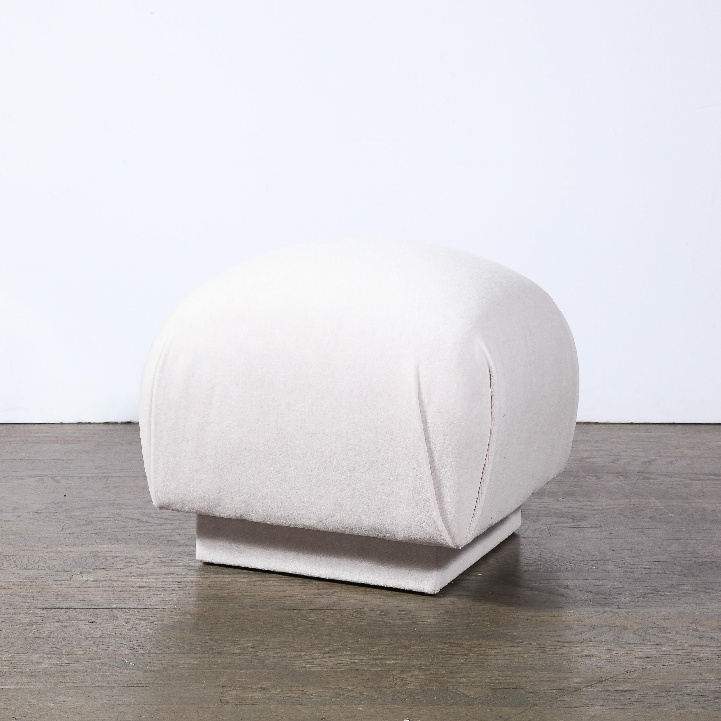 This sophisticated Mid-Century Modern Ottoman was realized by the esteemed Leon Rosen for Pace in the United States circa 1970. It features an elegantly domed and convex seat with perfectly gathered fabric at each corner sitting on a volumetric