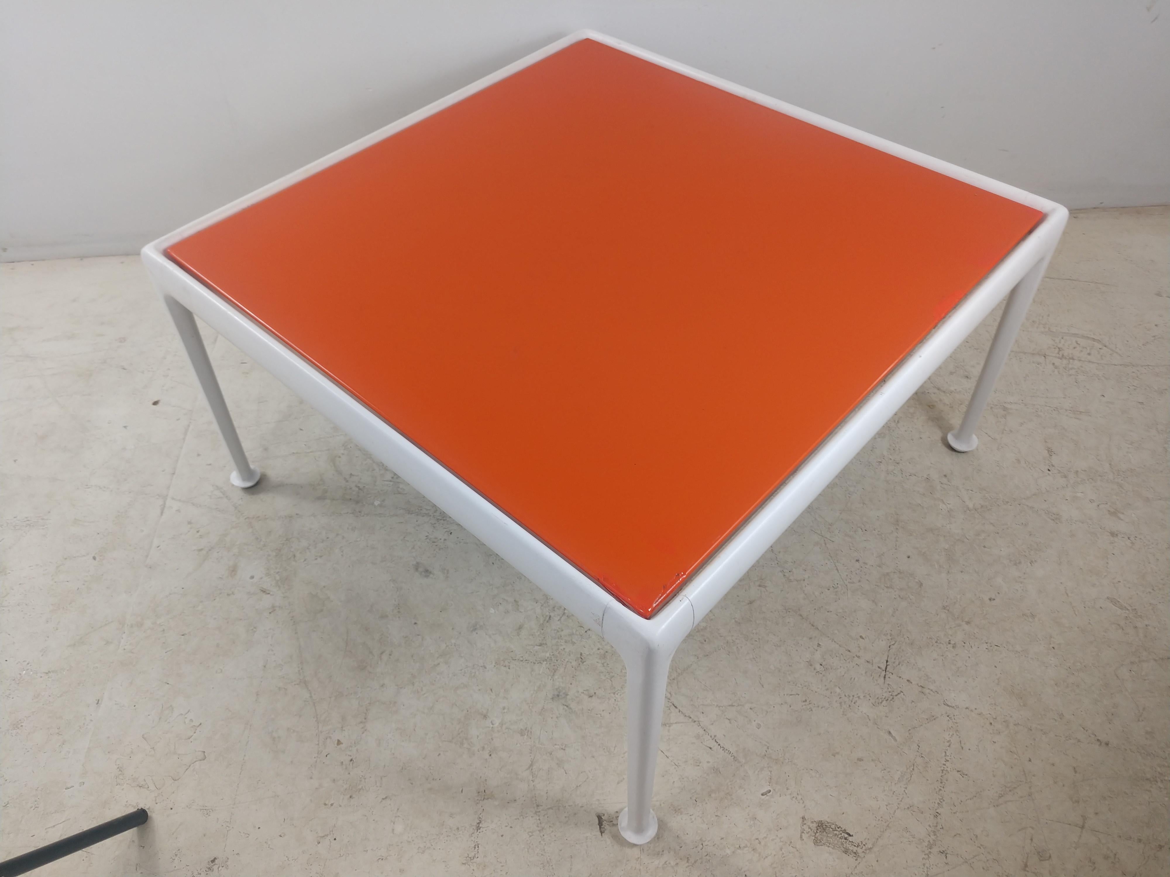 Fabulous cocktail table by Richard Schultz for Knoll in enameled steel top, orange and a powder coated base, circa 1974. Some minor chips to the top mostly on the corners which have been touched up. Base is very clean with original glides. This item