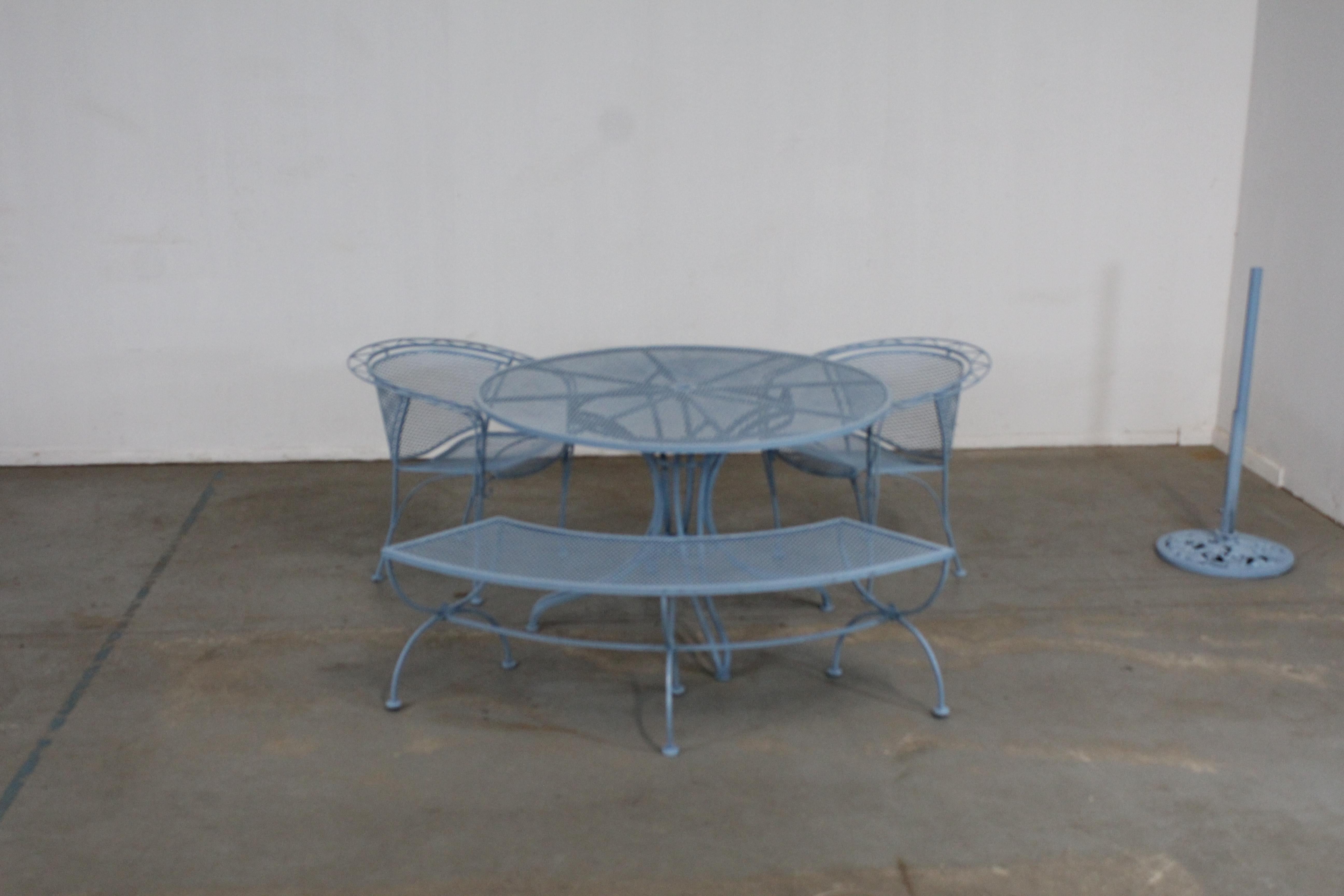 Mid-Century Modern outdoor iron table set with curved back bench and 2 chairs
Offered is a 5 piece set -mid century Danish modern bench, chairs and a table. In the style of Salterini. Features French Blue paint and woven wrought iron. Includes
