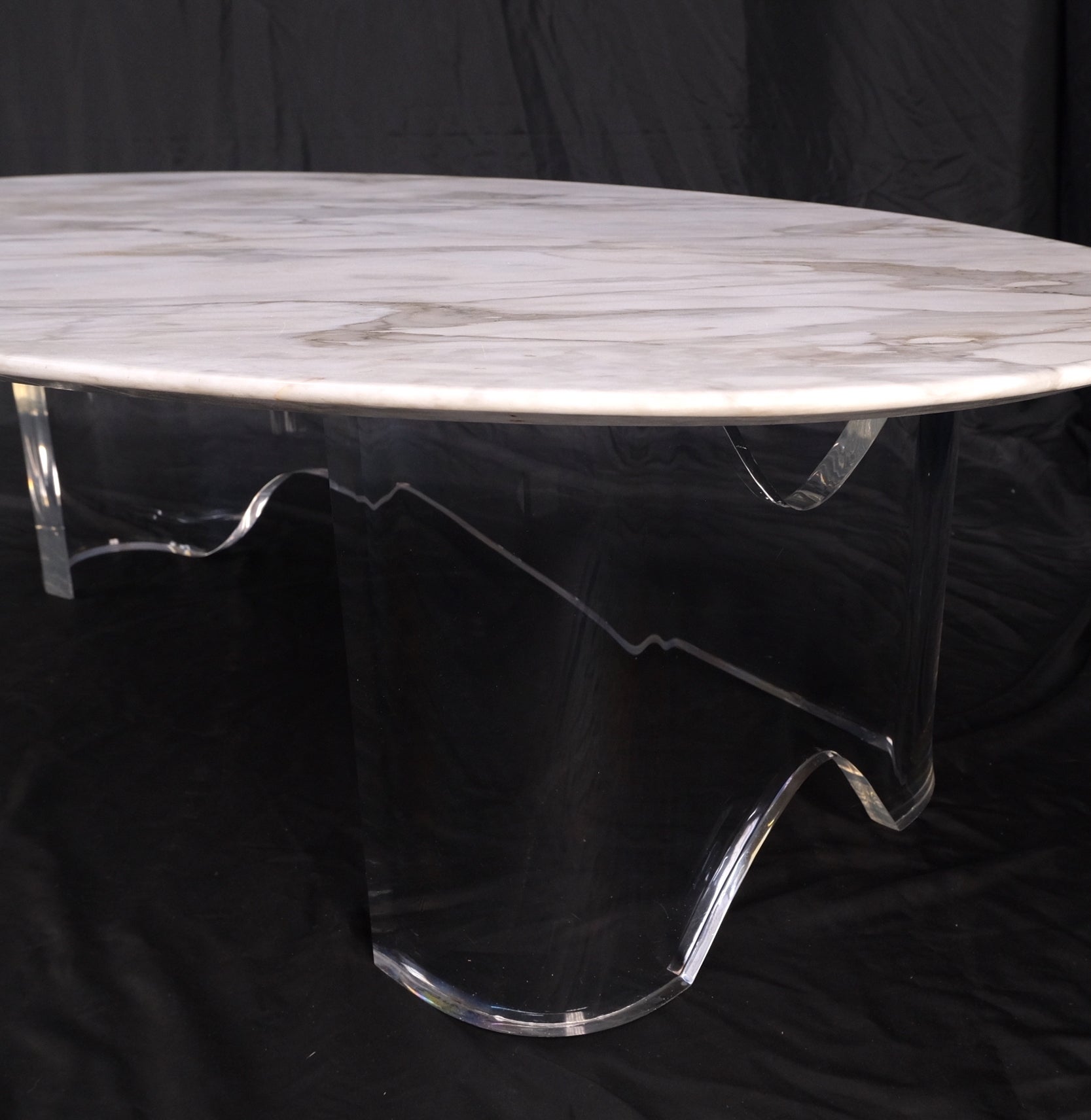 Mid-Century Modern oval carrara marble top organic Lucite base coffee table.
