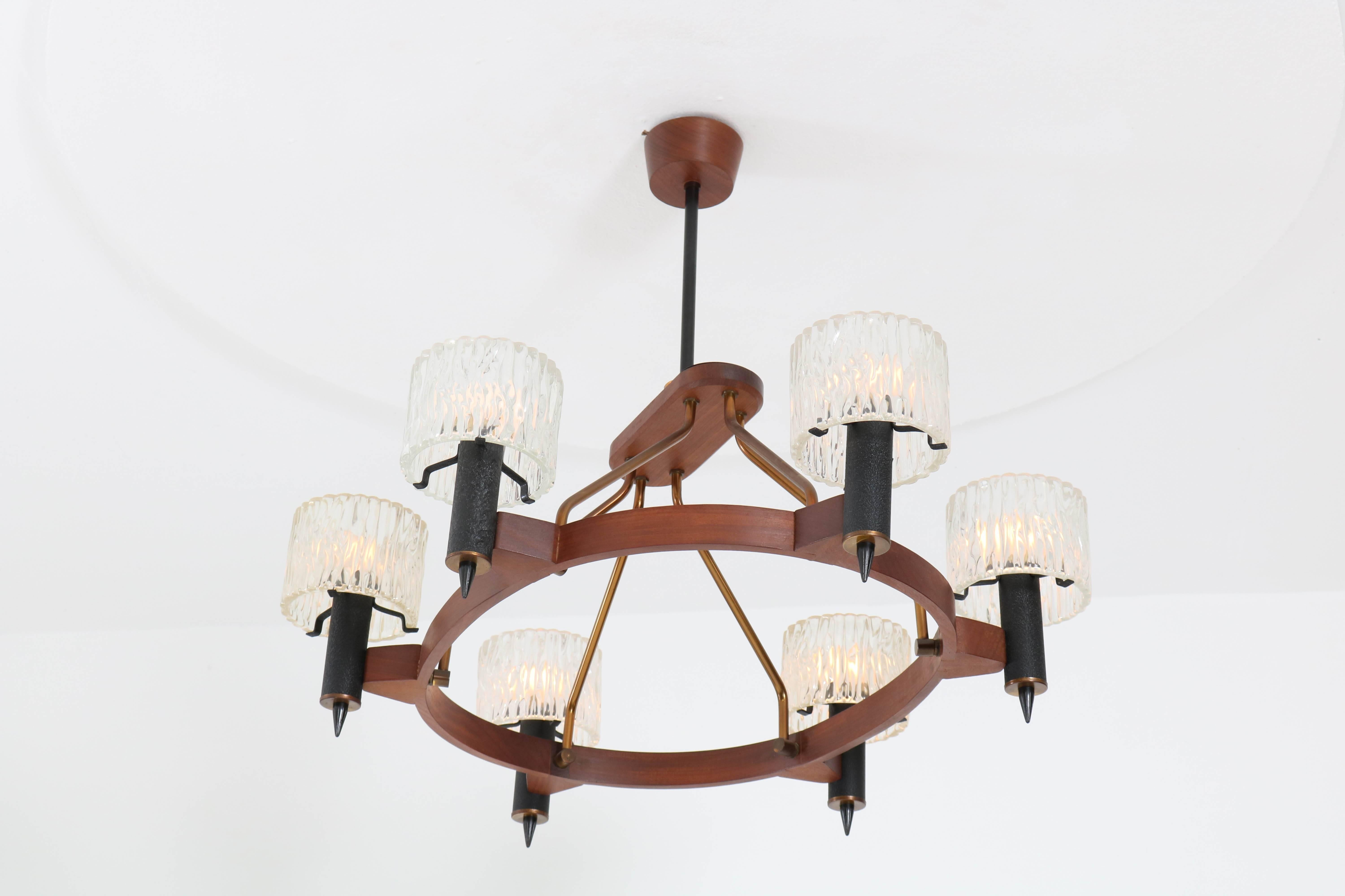 Rare Mid-Century Modern oval chandelier by Carl Fagerlund for Orrefors Sweden, 1950s.
Teak, black lacquered metal and brass frame with six original pressed and frosted glass shades.
In good original condition with minor wear consistent with age