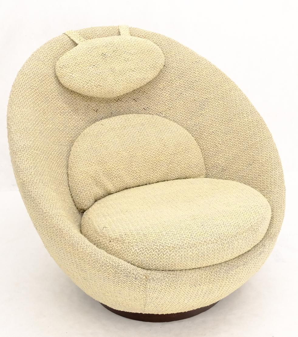 Mid-Century Modern egg shape pod armchair on walnut band shape base.