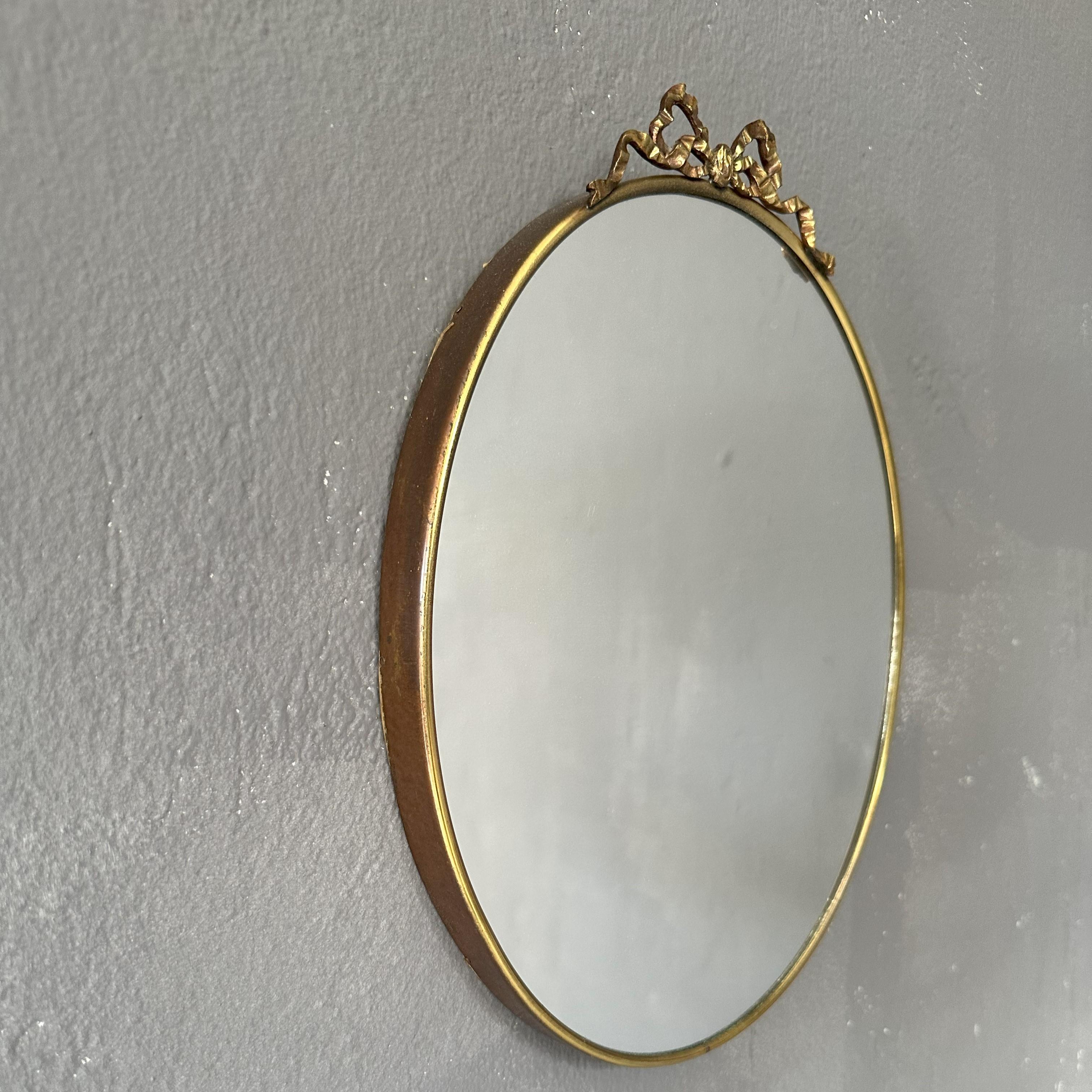 Mid-20th Century Mid-Century Modern, Oval mirror 1950s, Italian manufacture, with brass frame For Sale
