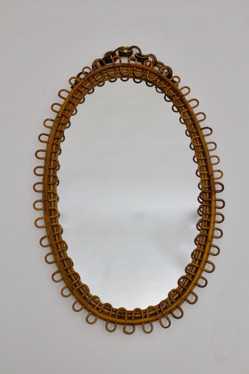 We present a very decorative Riviera style sunburst rattan wall mirror with curved beams.
The sunburst mirror is easy to hang up with a rattan chain.
Very good original vintage condition with minor signs of age and use.

approx. measures:
Width 44