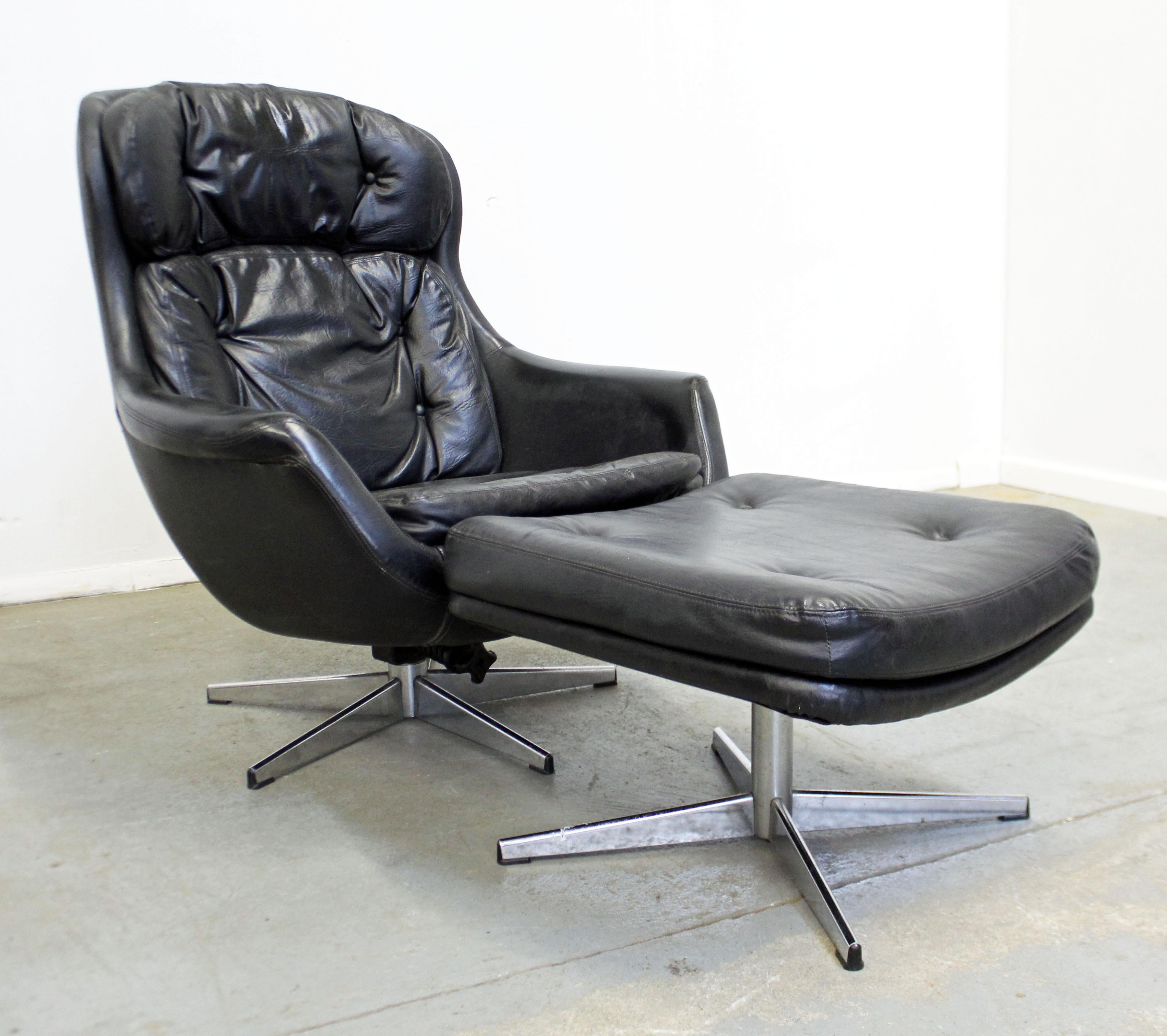 What a find. Offered is an egg style Mid-Century Modern lounge chair and ottoman by Selig Imperial. Features leather upholstery, chrome bases, and the chair rocks. Both the chair and ottoman swivel as well. It is signed by Selig Imperial. 
Approx.