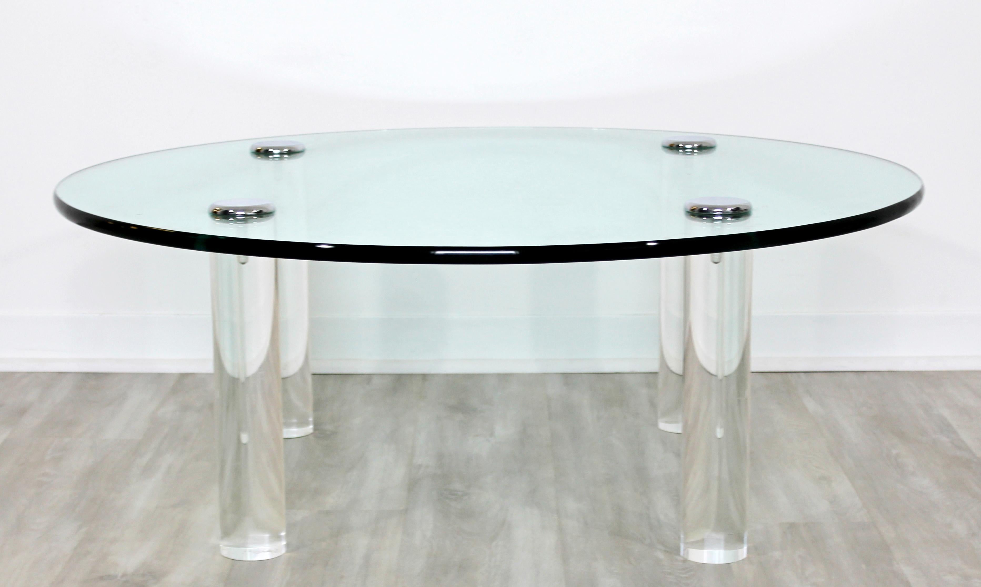 For your consideration is a stunning, round coffee table, made of glass and lucite and with chrome caps, by Pace, circa the 1970s. In excellent condition. The dimensions are 42