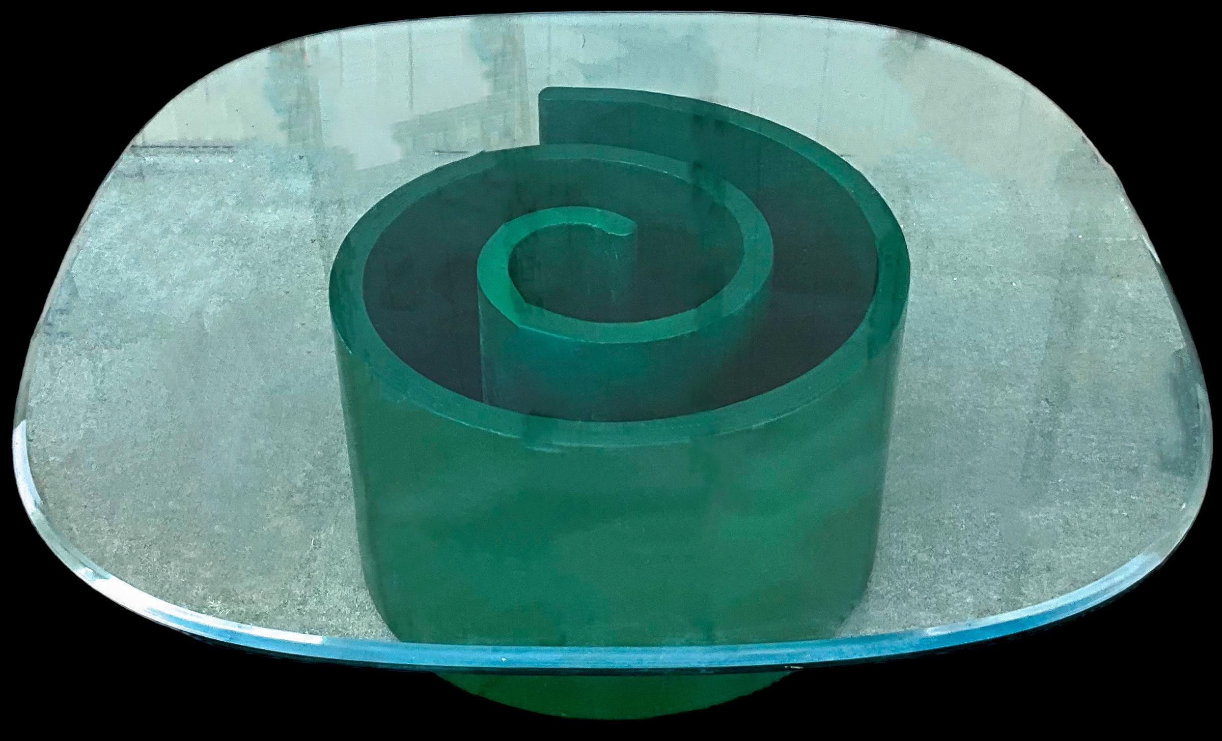 This mid-century modern vibrant green snail form coffee table is attributed to Vladimir Kagan for Selig. It dates to the 60s, and it is in good condition. The glass is 42 inches square with rounded corners. 