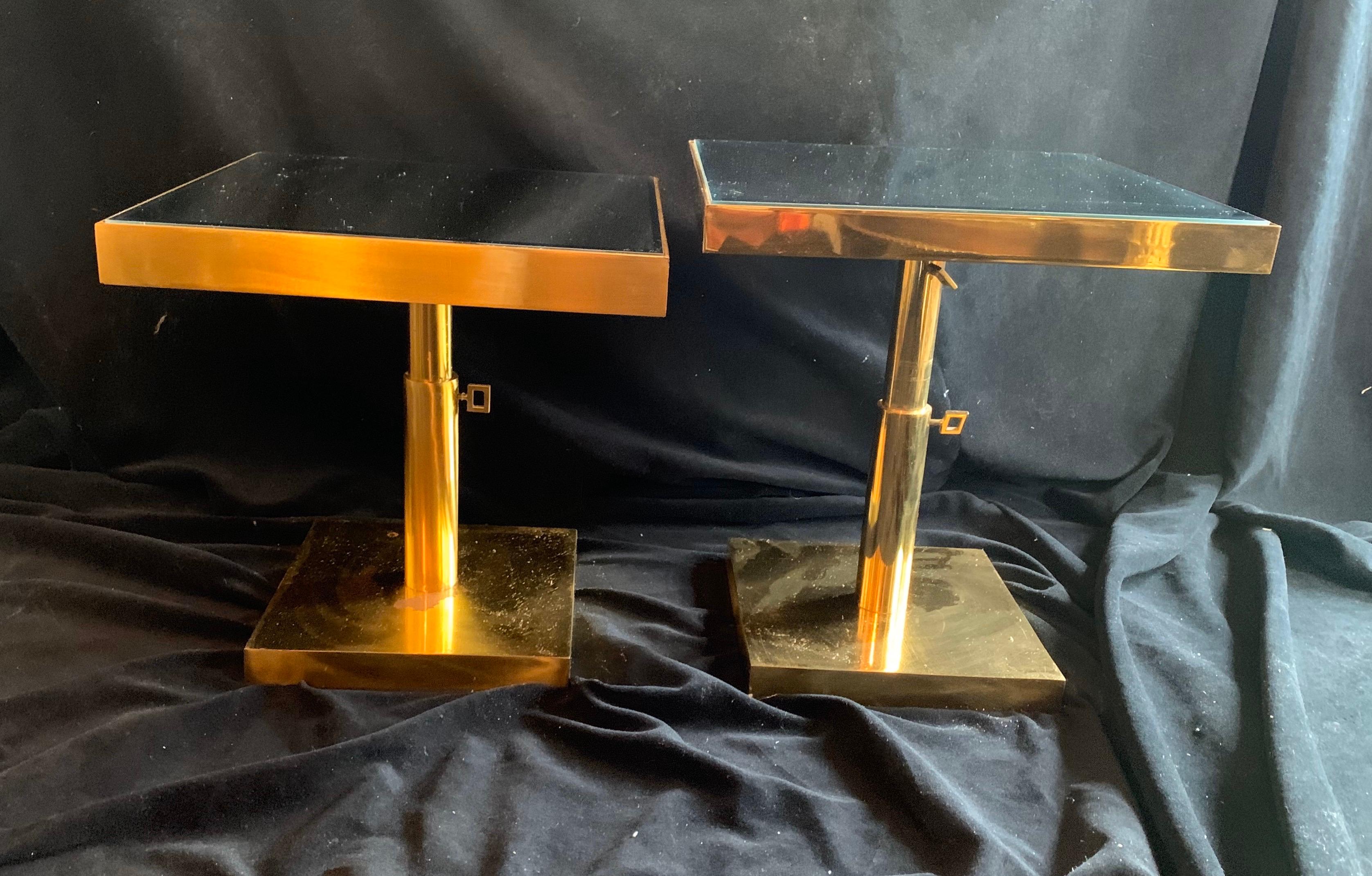 A wonderful pair of Mid-Century Modern bronze and beveled mirror, telescoping square side tables height is adjustable by 2 knobs.
Purchased from Lorin Marsh showroom in New York City.