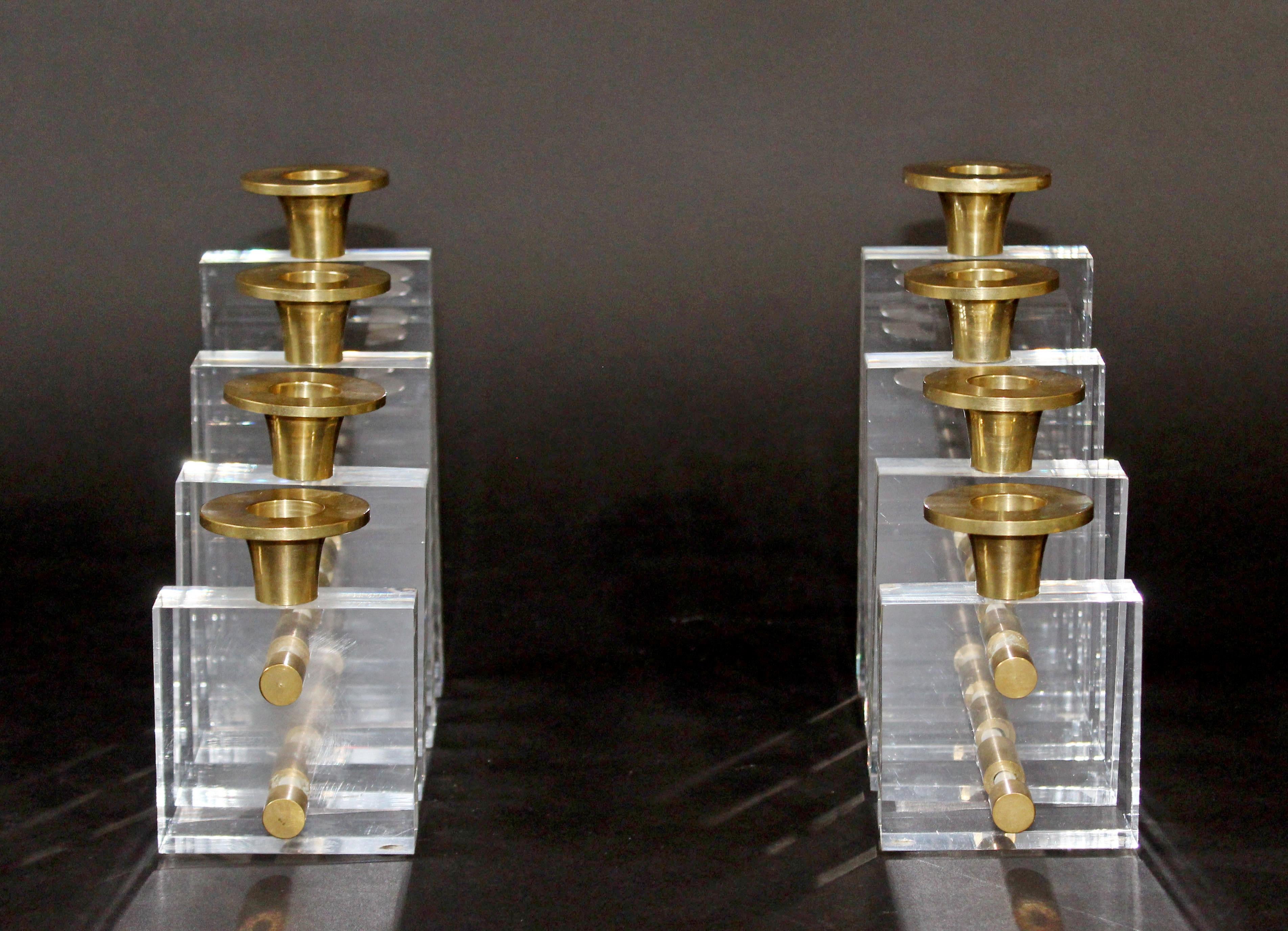 For your consideration is a phenomenal pair of candle holders, made of Lucite and brass by Charles Hollis Jones, circa the 1970s. In excellent condition. The dimensions of each are 3