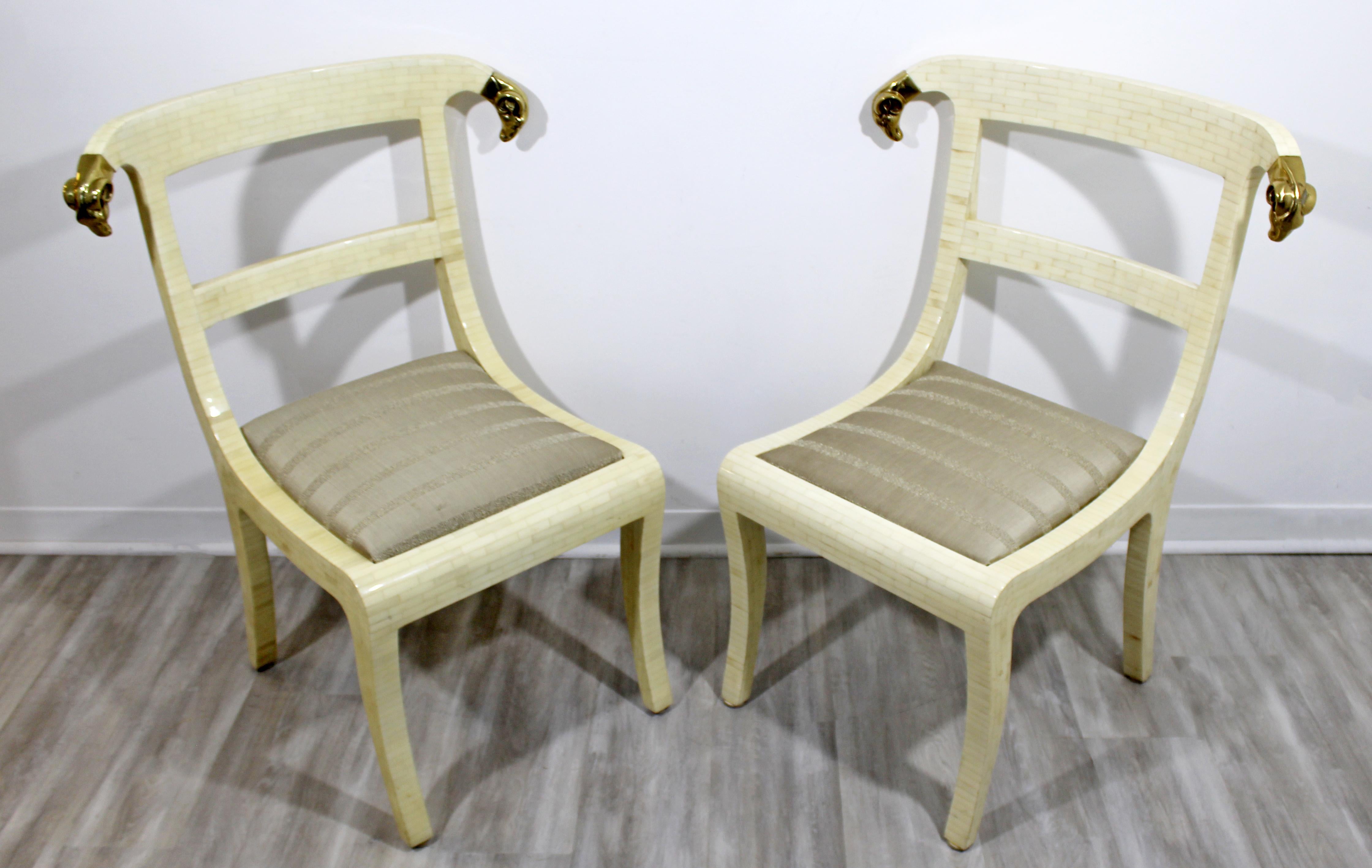 For your consideration is a sensational pair of lounge accent chairs, made of tessellated stone and with brass rams head accents, for Jimeco, made in Colombia, circa the 1970s. In excellent vintage condition. The dimensions of each are 18.5